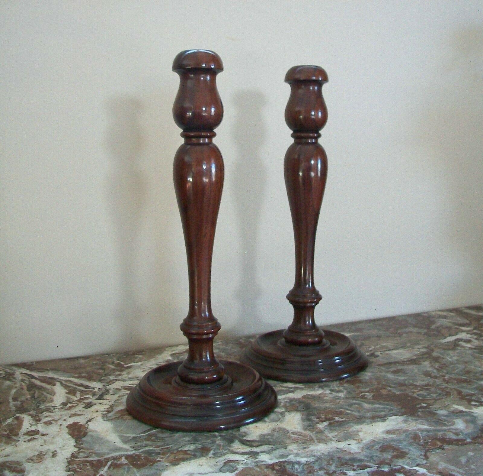 Antique large pair of hardwood candlesticks - lathe turned - rich patina - original wool felt liners to the bases - unsigned - United States - circa 1900.

Excellent antique condition - minor scuffs - no loss - no damage - no restoration - old glue