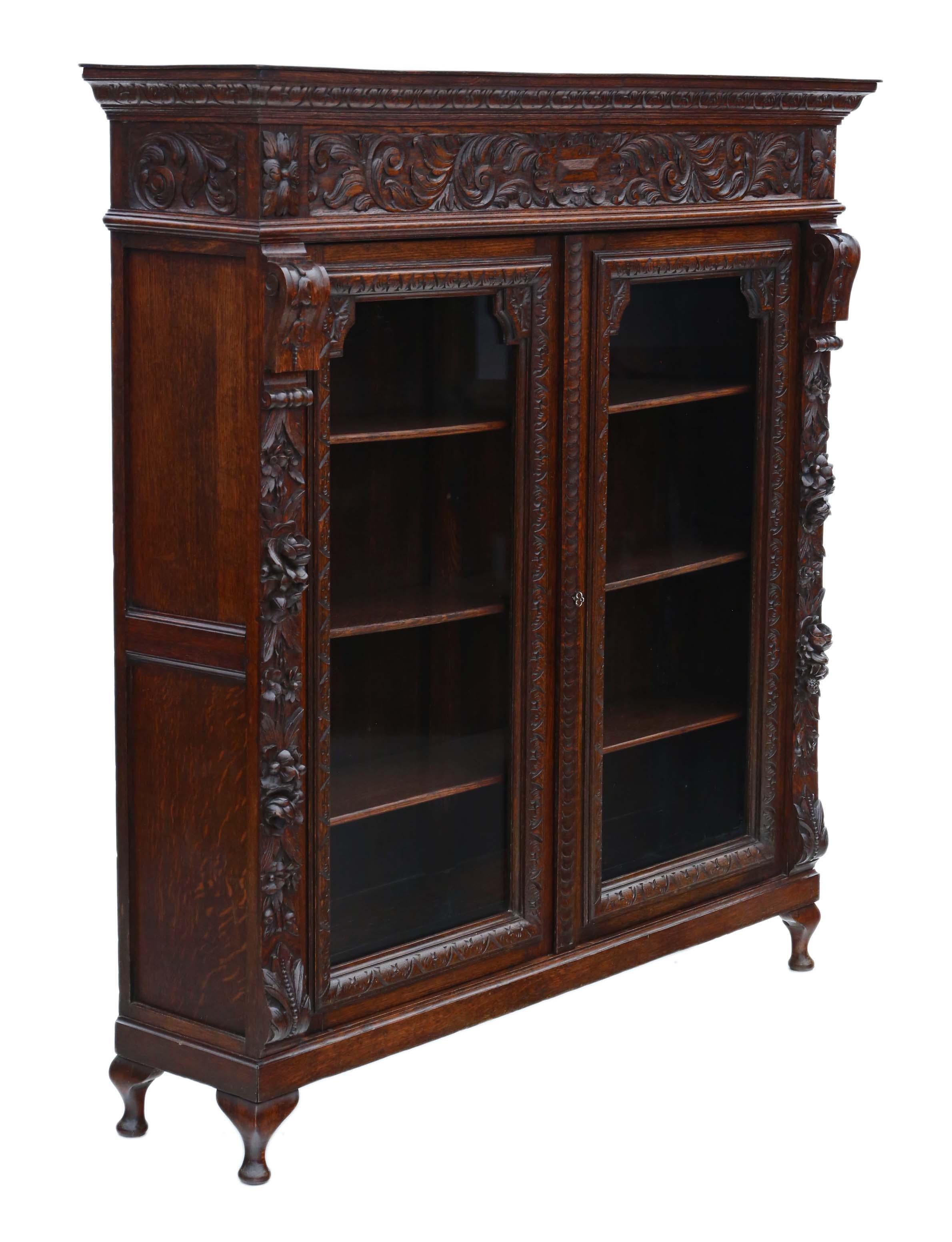 Antique large fine quality 19th century carved oak glazed bookcase C1895.

This is a lovely quality bookcase, that is full of age, charm and character.

Solid, with no loose joints and no woodworm.

The shelves are held in place by pinned in