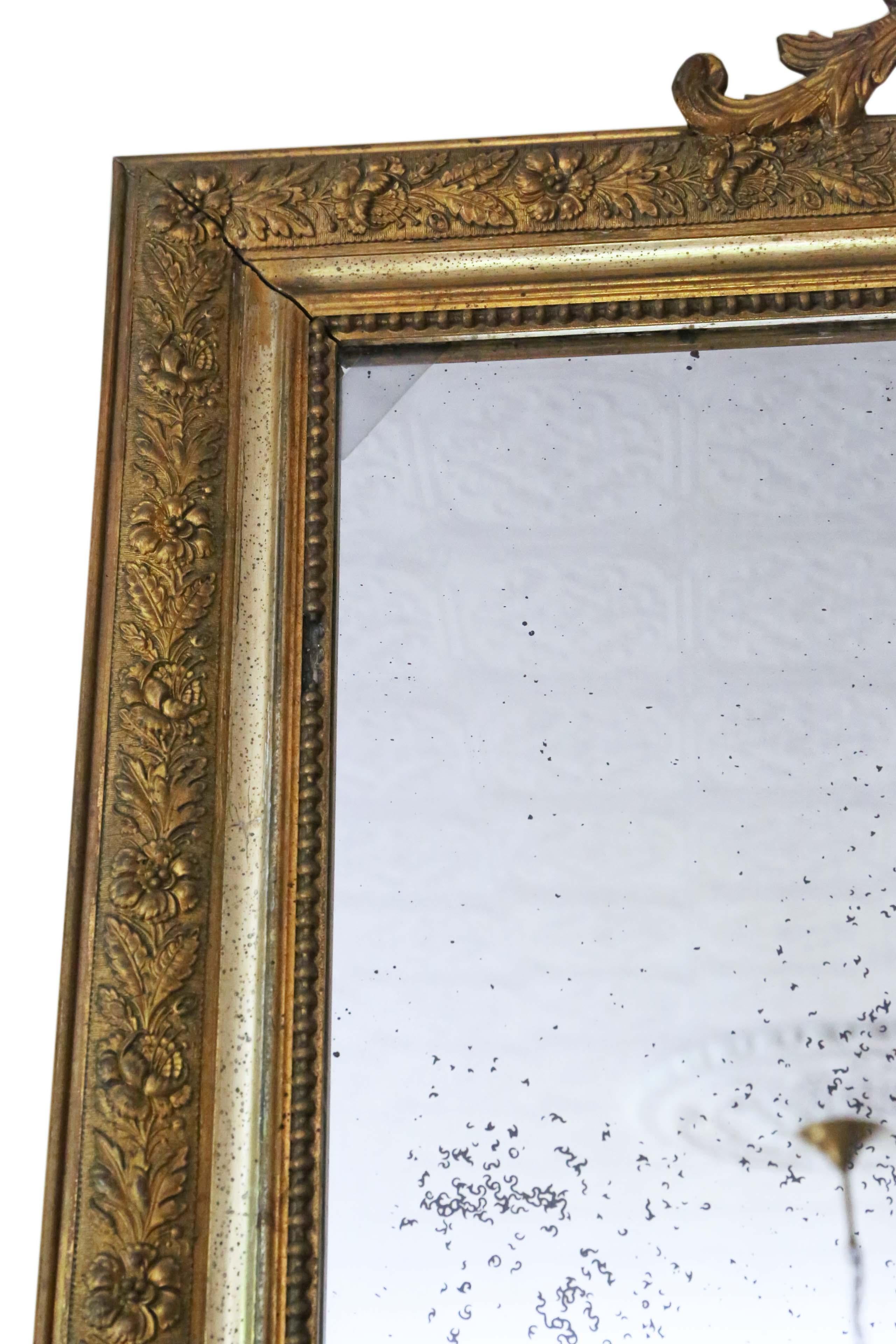 Victorian late 19th century French gilt overmantle or wall mirror. Lovely charm and elegance.
An impressive and rare find, that would look amazing in the right location. No woodworm.
The original mirrored glass has attractive medium to heavy