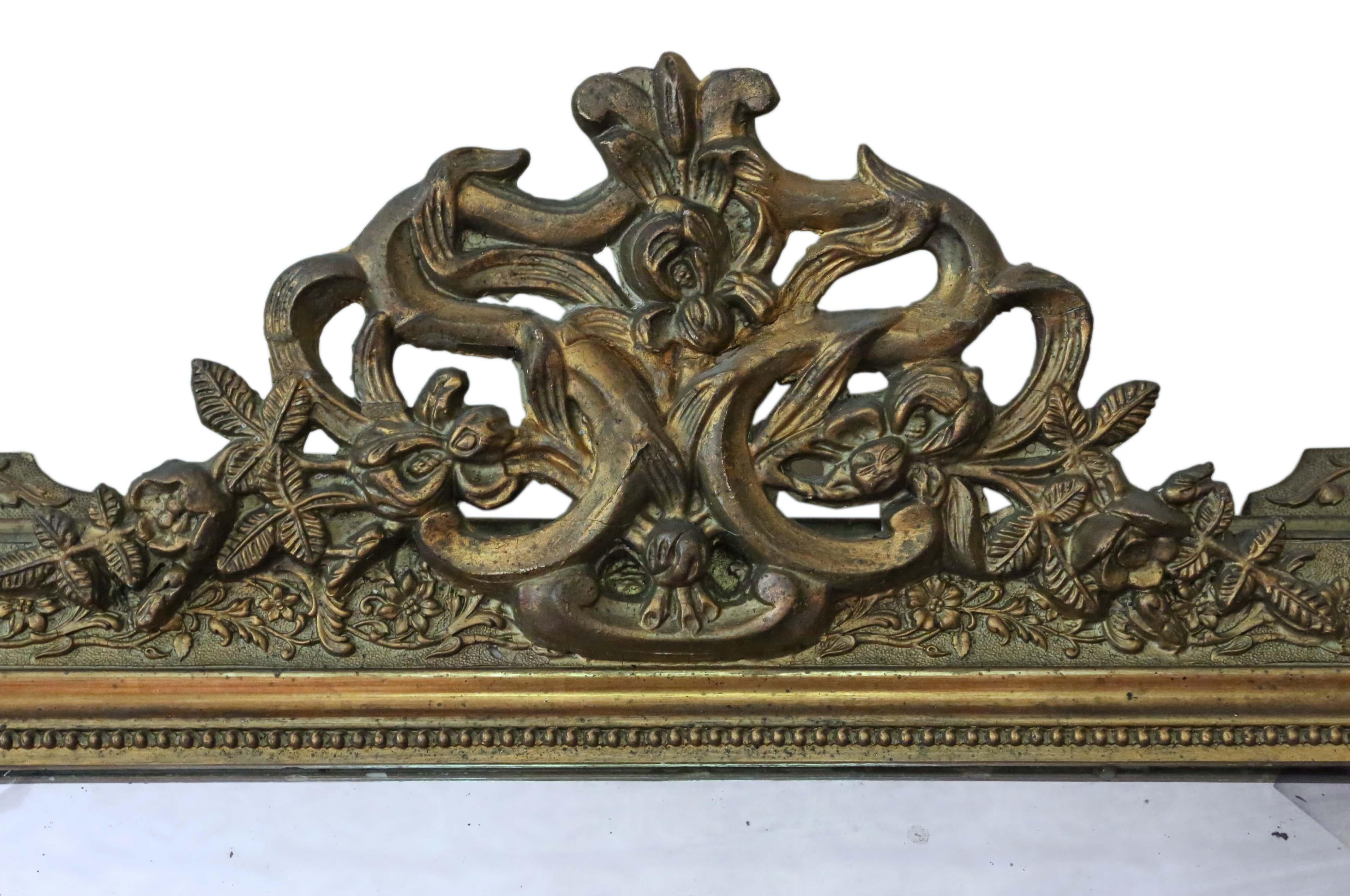 Victorian late 19th century French gilt overmantle or wall mirror. Lovely charm and elegance.
An impressive and rare find, that would look amazing in the right location. No woodworm.
The original mirrored glass has light to medium oxidation and