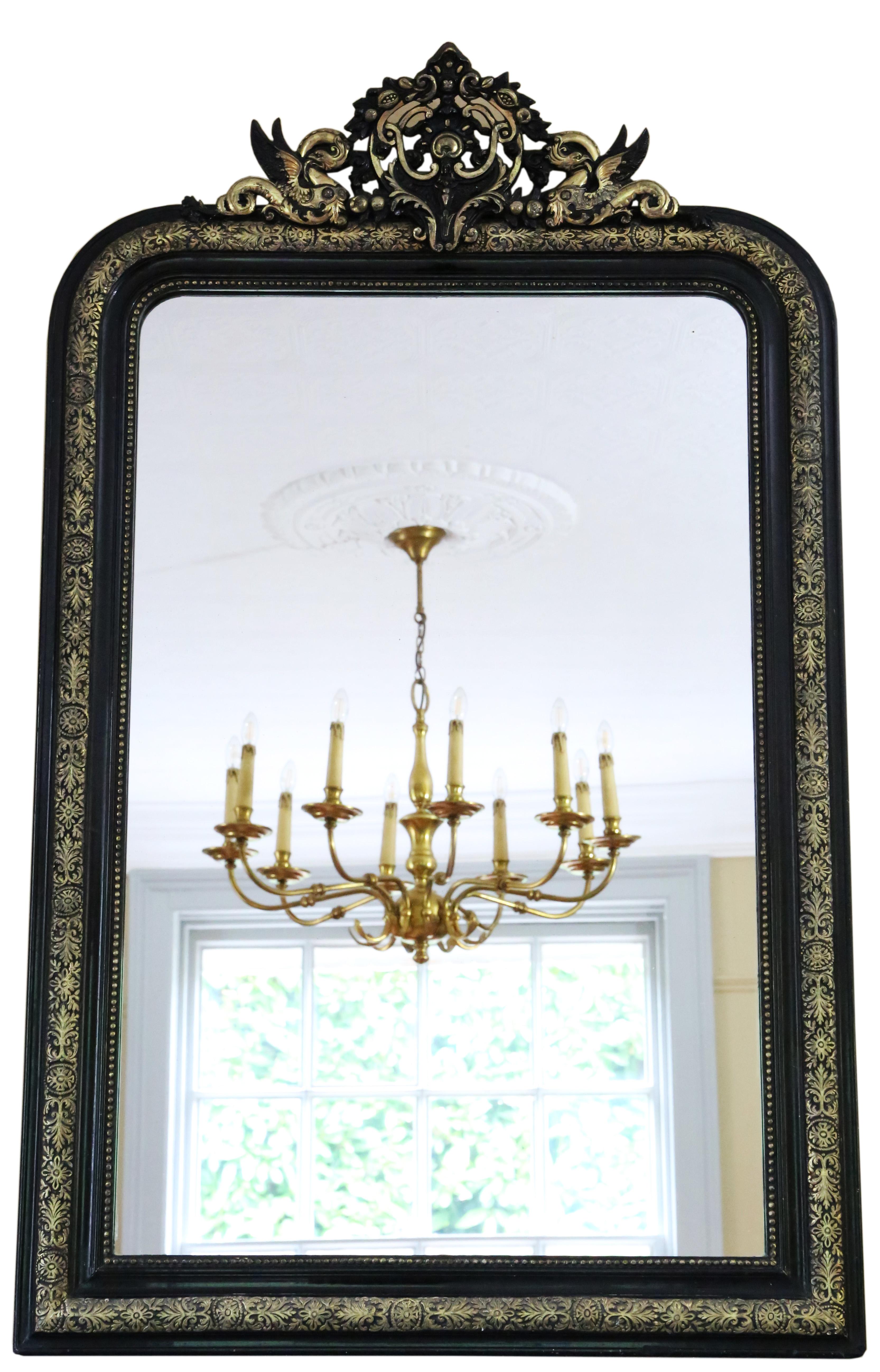 Magnificent and very large 19th Century ebonised and gilt overmantle wall mirror, showcasing exceptional quality and adorned with a charming dragon crest for added elegance.

This delightful and uncommon mirror stands out as a lovely and rare find,