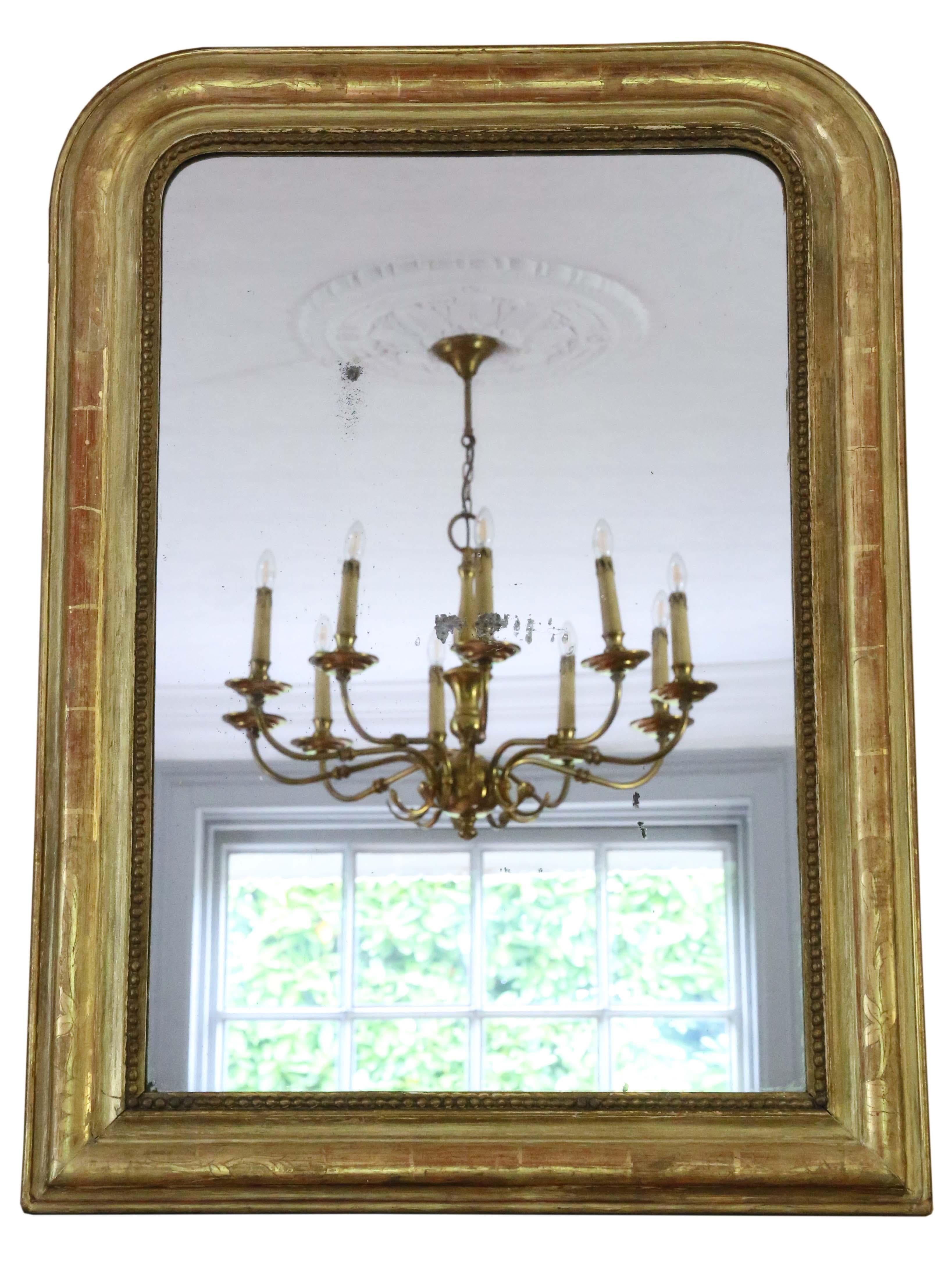 Antique shaped 19th Century large quality gilt overmantle or wall mirror. Lovely charm and elegance. Original finish with minor losses, refinishing and touching up.

An impressive find, that would look amazing in the right location. No loose