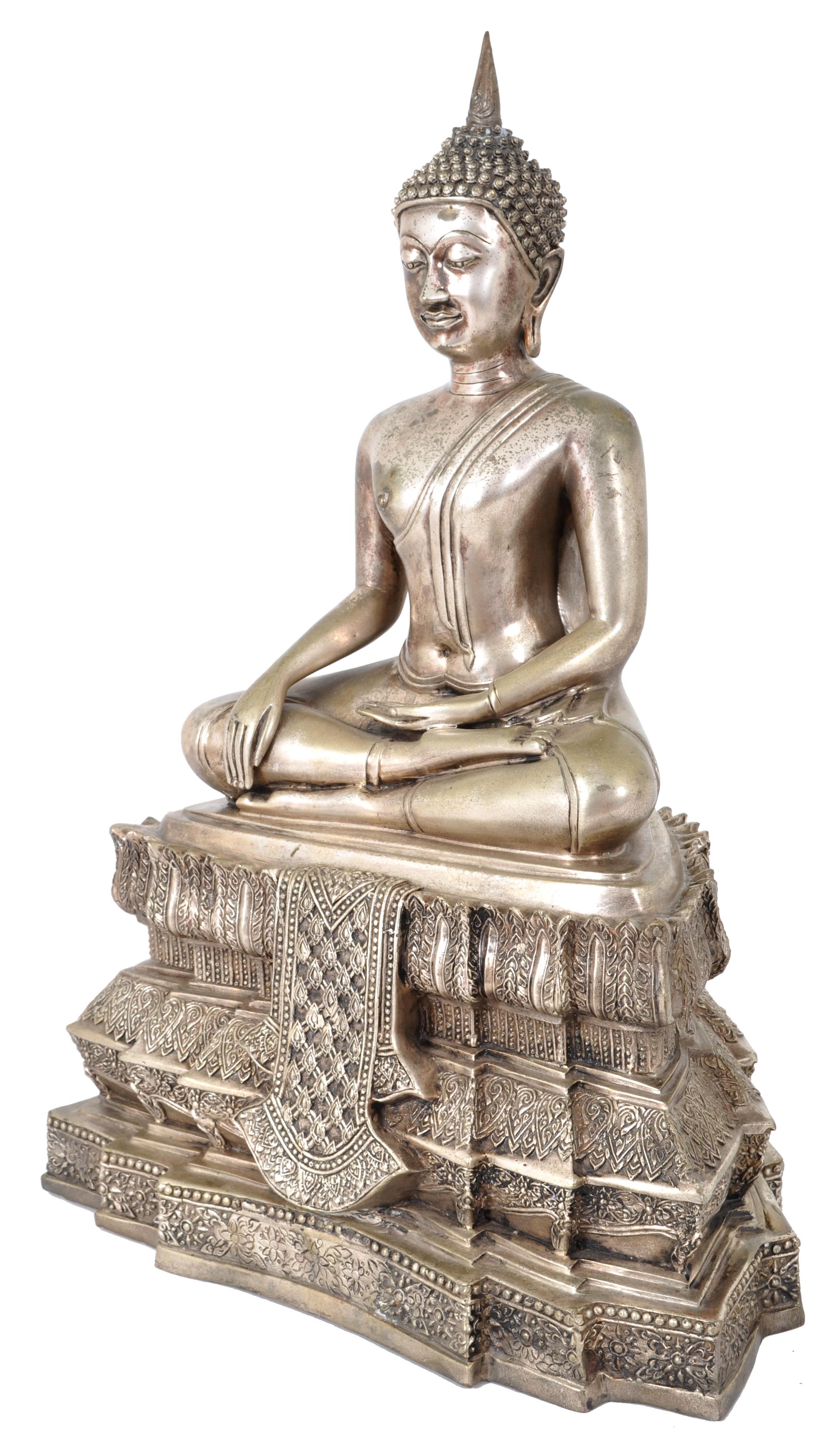 A fine and large antique silver-gilt bronze Tibetan statue of Buddha, circa 1850. The Buddha shown in Bhumisparsha mudra pose (touching the earth), having tight curls & a pointed ushnisha. The Buddha raised on an unusually tall & ornately engraved