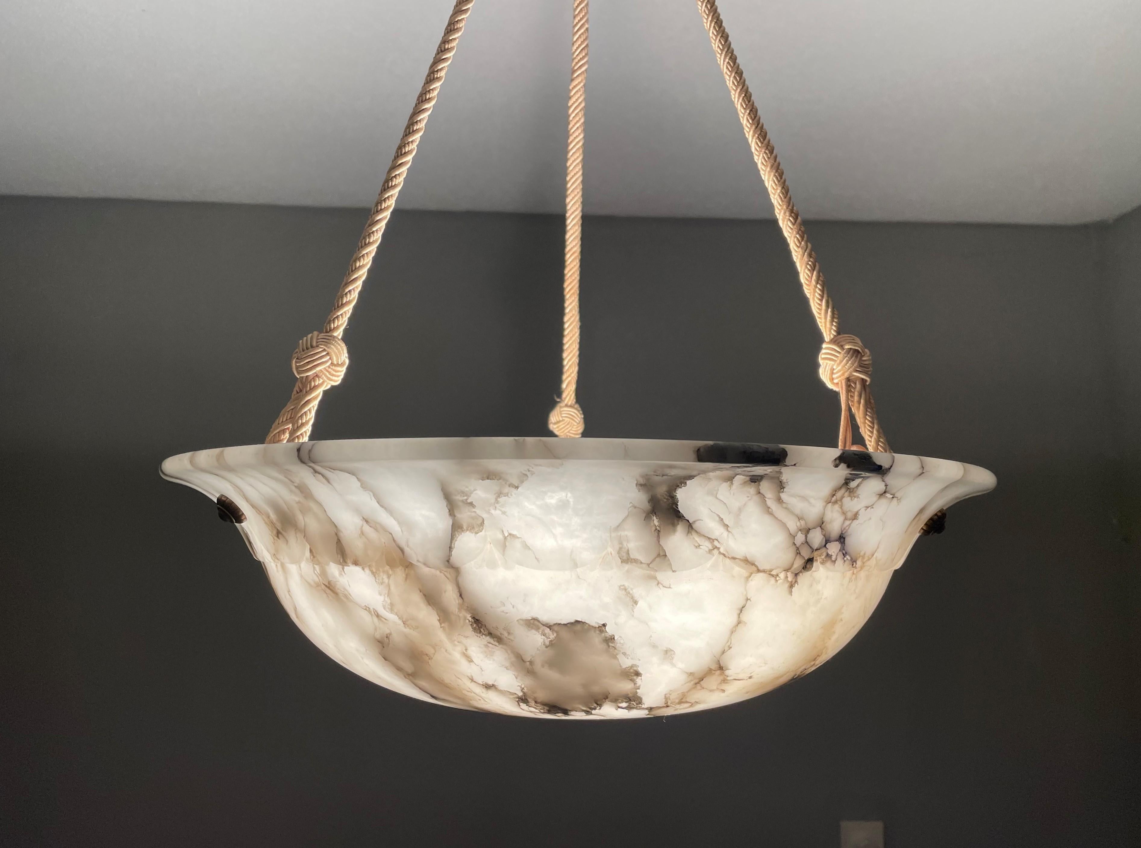 Exceptional alabaster pendant with a perfect shade and canopy.

Over the years we have seen and sold a number of alabaster pendants that were even better than the top quality ones that we sell regularly. This top quality specimen really ticks all