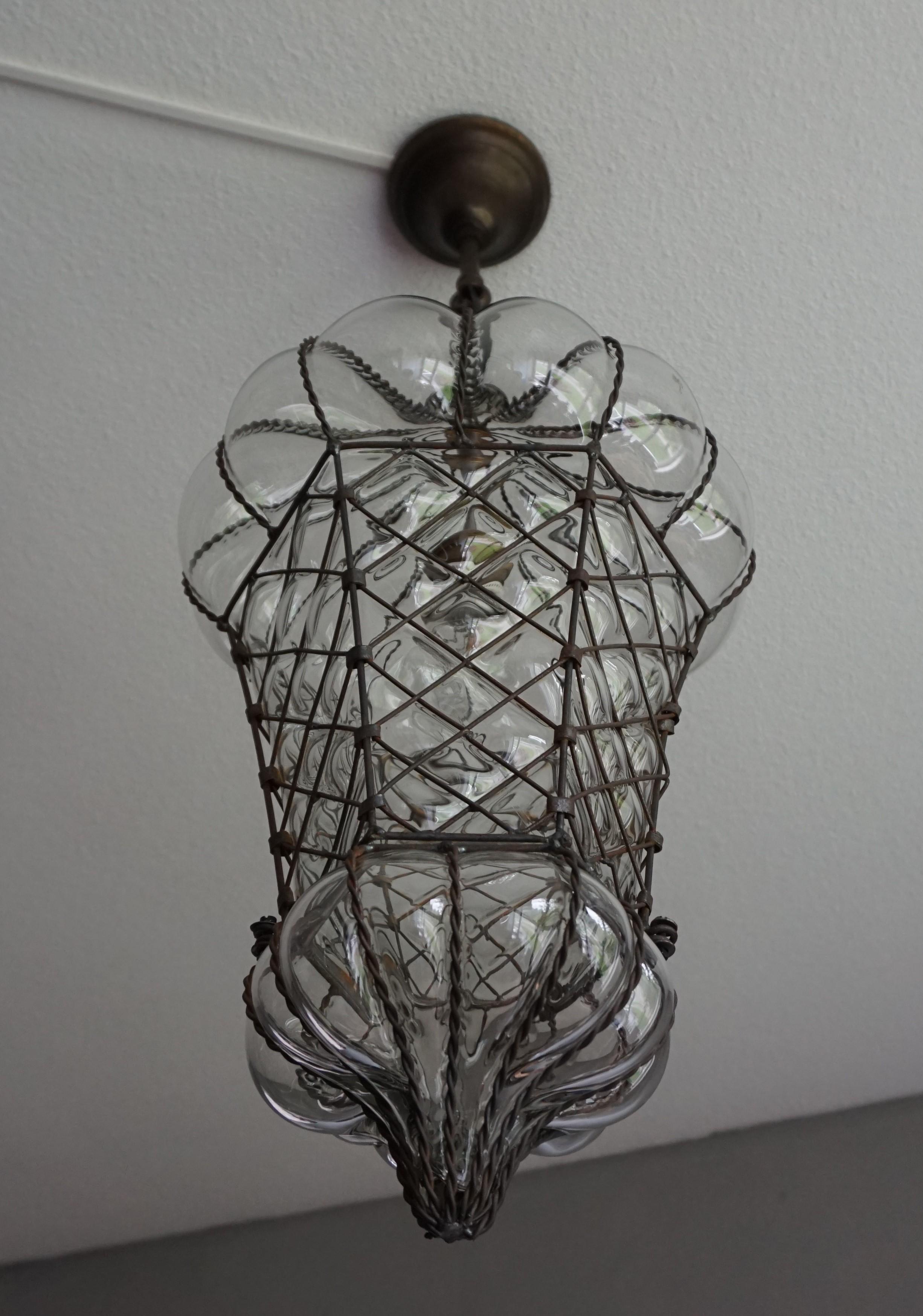 Large, transparent glass antique Venetian light fixture.

This antique Venetian pendant is one of the largest of it's kind we ever had the pleasure of offering. We have completely rewired it for safe and immediate usage the world over and we have