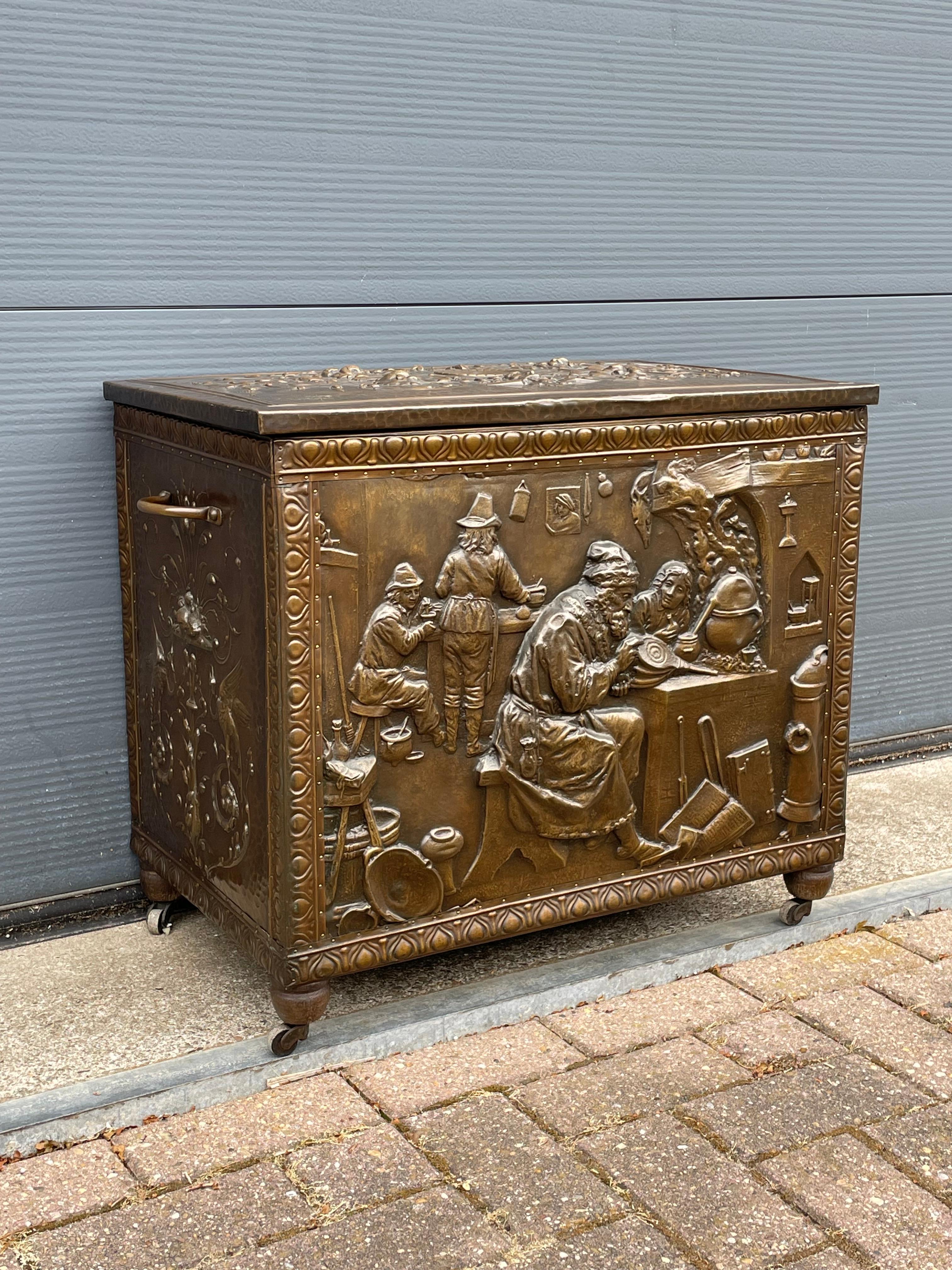 All handcrafted and rare, brass firewood bucket by A. Arens of Antwerp, depicting the alchemist.

Only if you were a very wealthy person in Europe in the late 1800s, would you be able to afford this large, impressive and all-handcrafted, chest-like