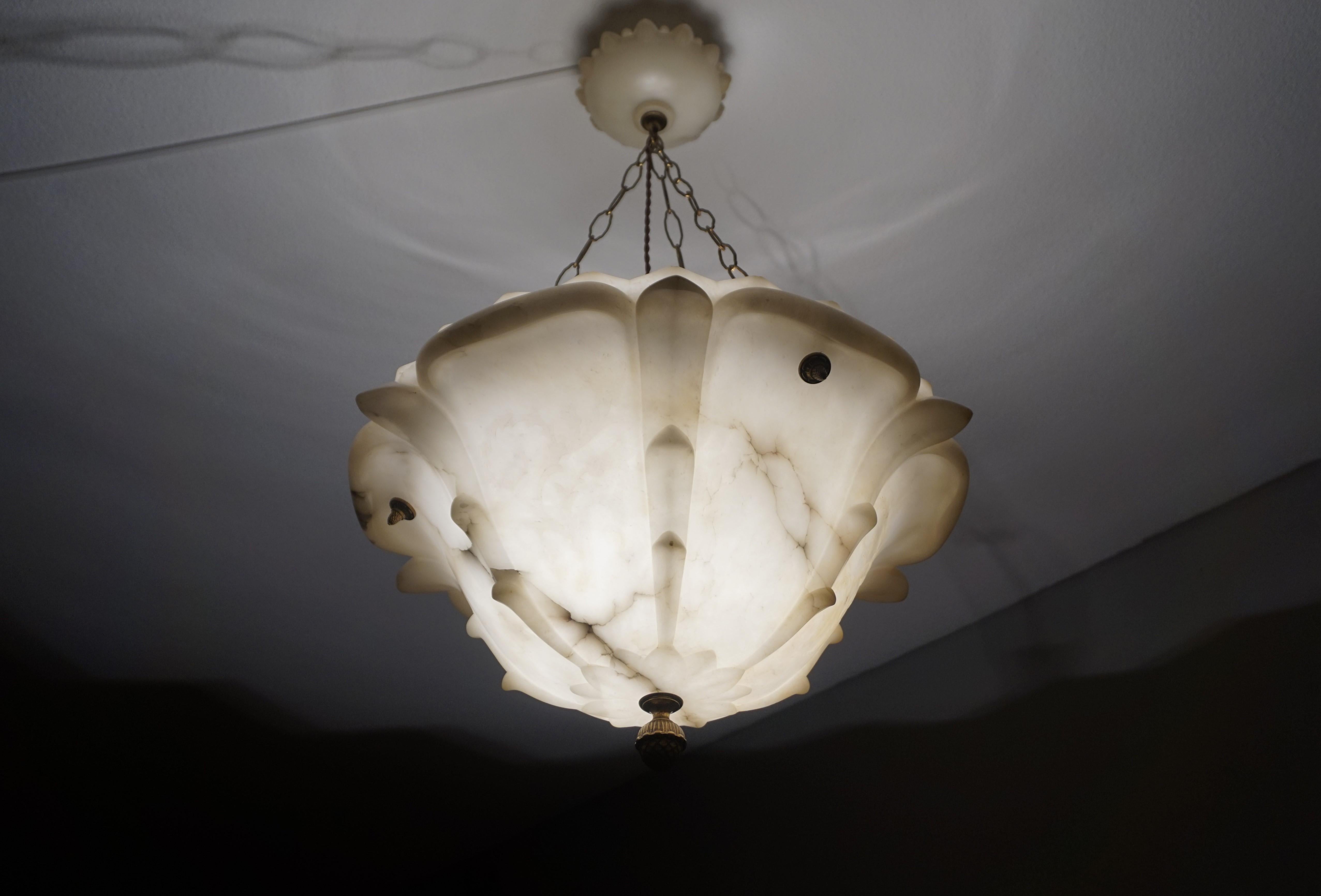 Enormous and aesthetically marvelous, alabaster flower sculpture pendant.

It is early in the new year, but we have already made a few new clients happy with some of our antique light fixtures and when we first saw this very large and deep alabaster