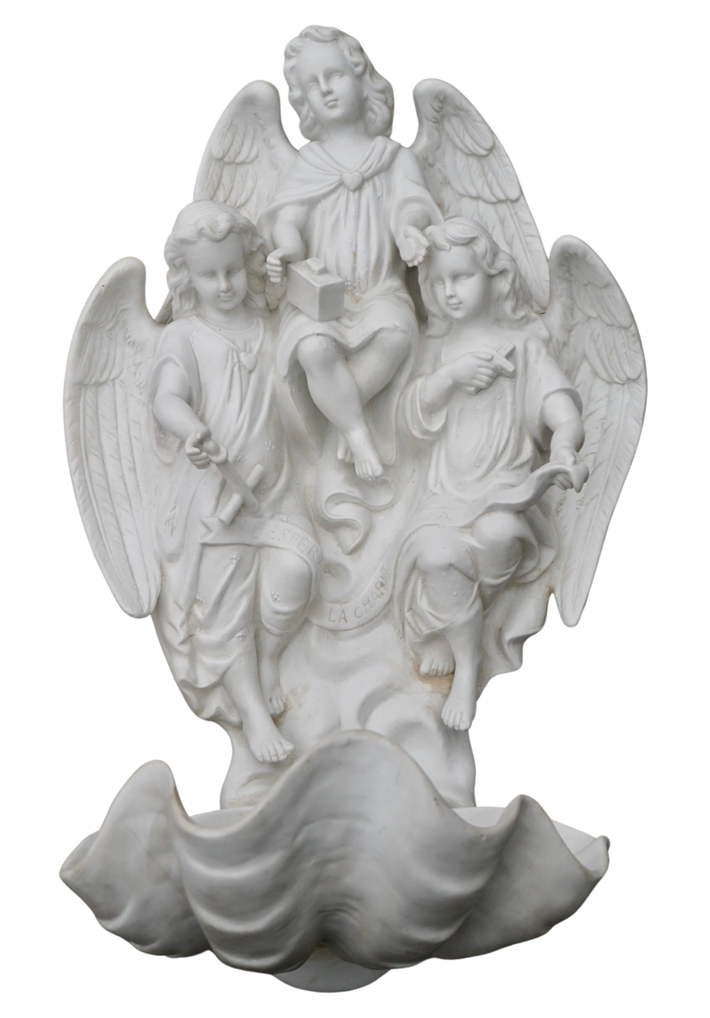 Rare antique large bisque porcelain holy water font with angels.

A beautiful quality large antique holy water font for the wall, made of bisque porcelain. Depiction of three angels with a shell as a holy water font. Signed on the back L M. Made in