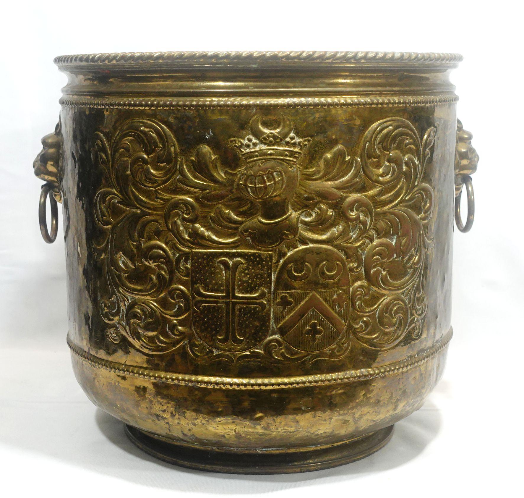 Antique Large Brass Firewood Bucket w/Repousse of Armorial Patterns, and the Lion Head handles.
This is a very delicate hand-made bucket from the 19th century. 