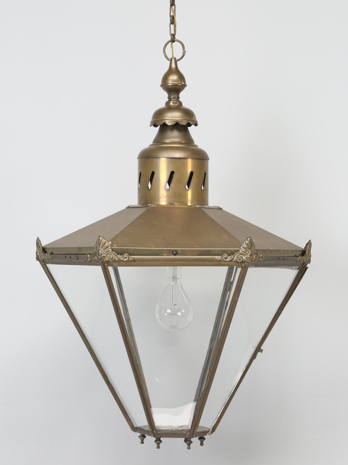 Antique French or possibly English, very large brass lantern. Although we purchased this antique brass lantern in France, there is a part of us, that thinks they could have originated in England? What we find most unusual about this antique lantern,