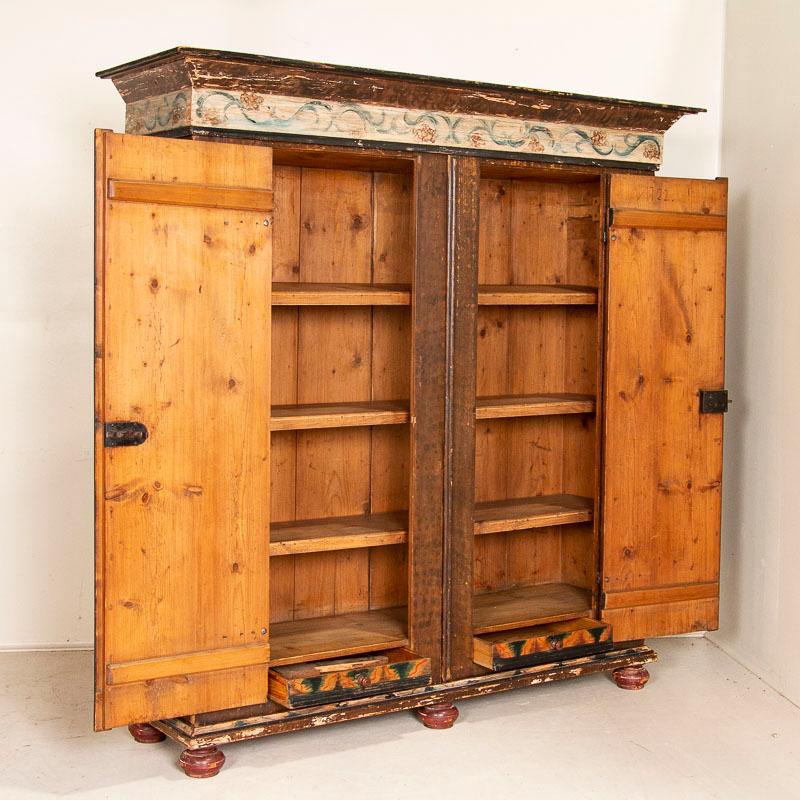 This amazing original painted large armoire or 