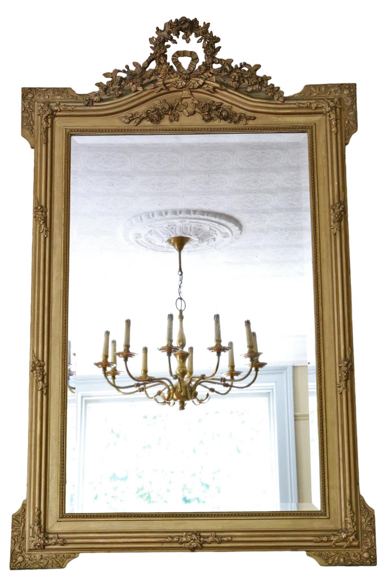 Large Antique C1900 Gilt Overmantle Wall Mirror – High-Quality Ornate Design

This mirror features a striking design, making it a captivating addition to any suitable space. The frame is solid with no loose joints, ensuring durability and no