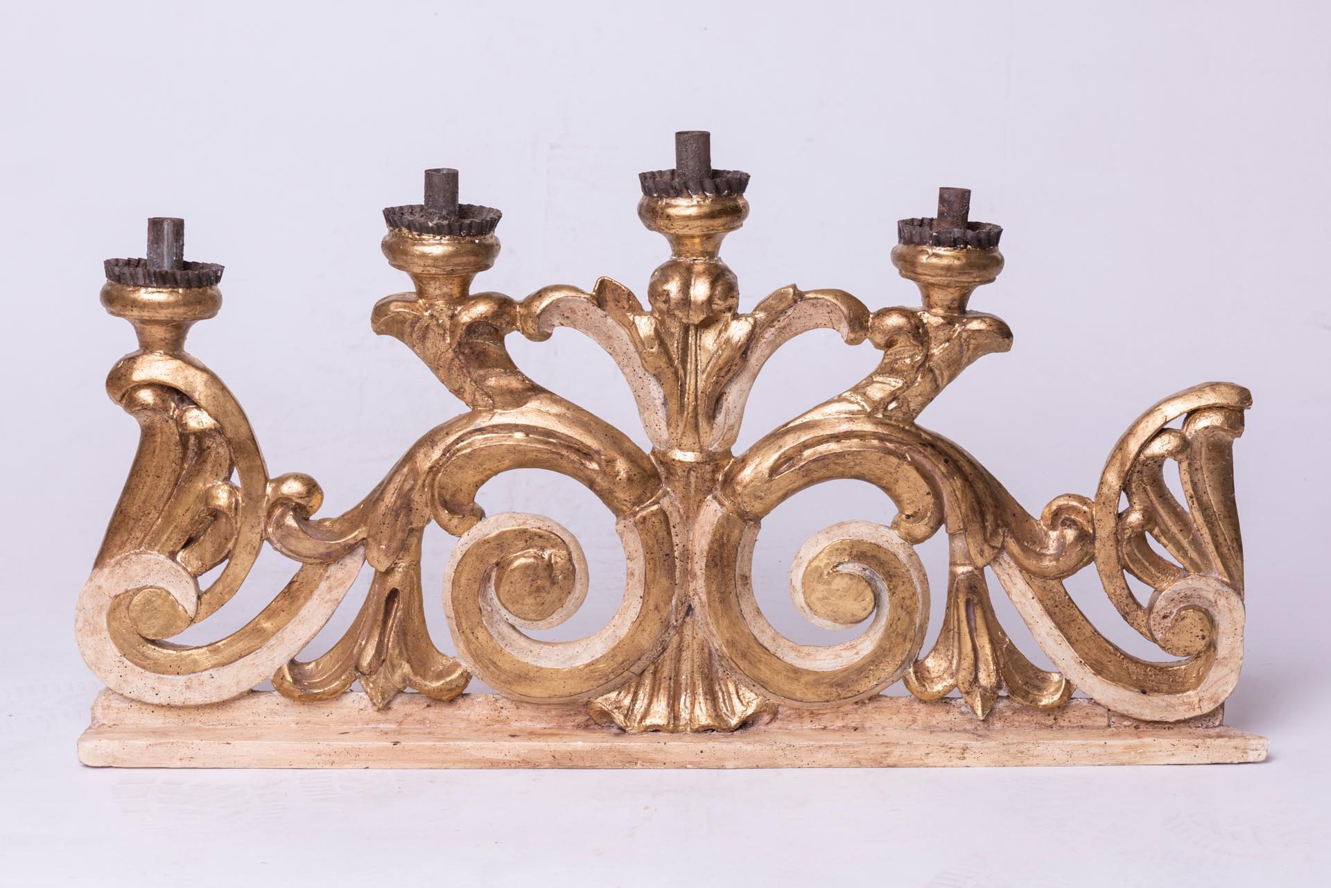 A pair of large, important, gilded, lacquered wood pyramid-shaped candlesticks.
I have other two similar ones,  which I joined together: completing with a padded fabric panel, it becomes a headboard.

ref. O/5227.