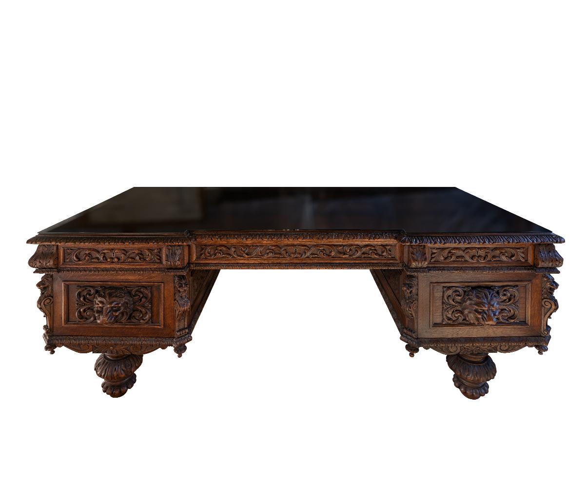 Renaissance Revival Antique Large Carved Oak Baronial Glass Top Desk and Gilt Embossed Leather Chair