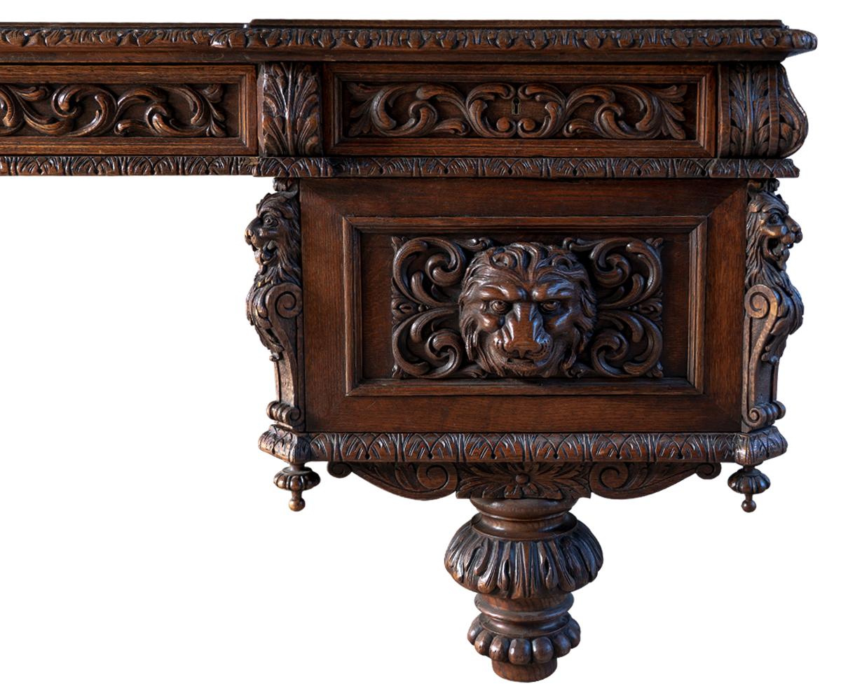 Antique Large Carved Oak Baronial Glass Top Desk and Gilt Embossed Leather Chair In Good Condition In Laguna Beach, CA