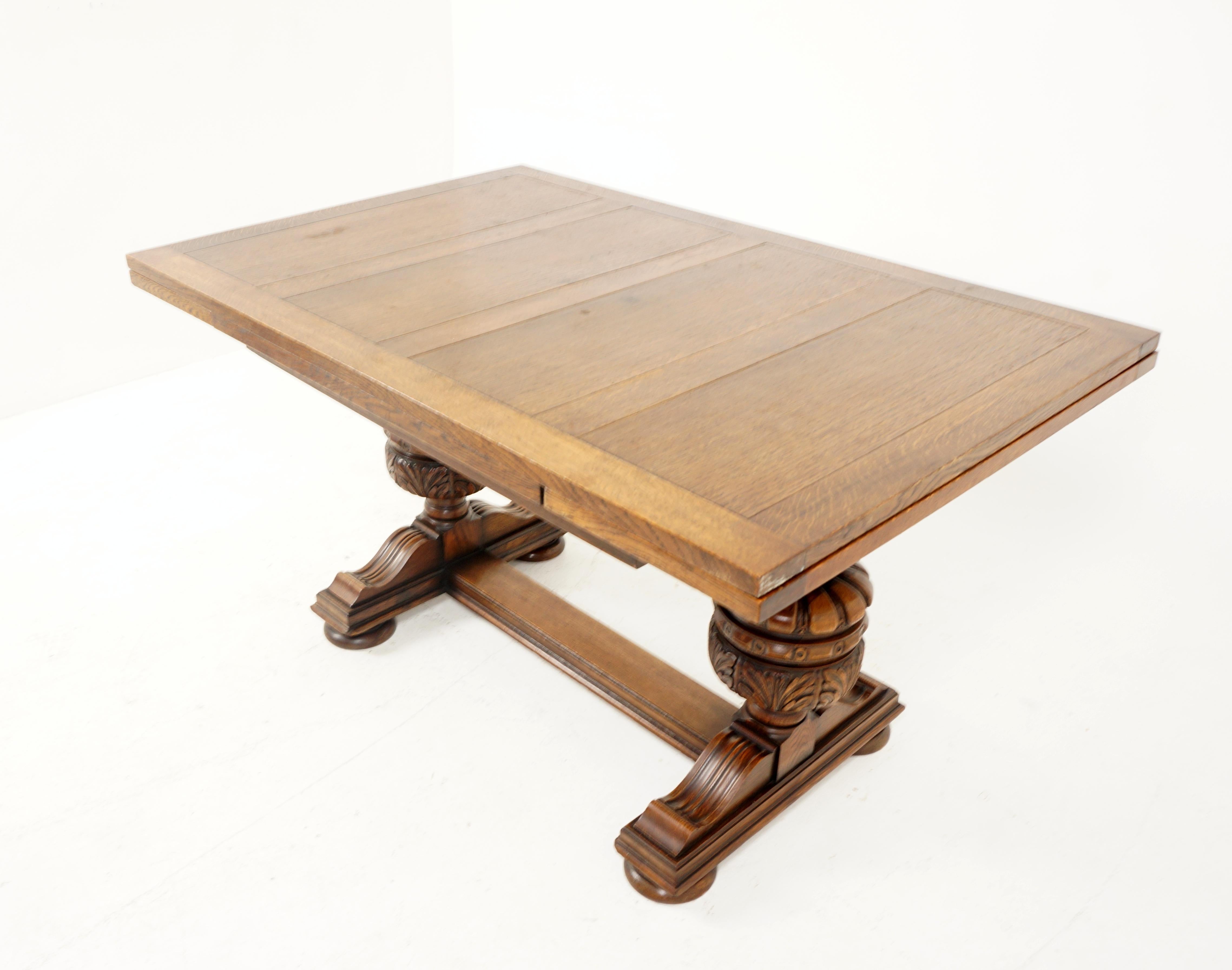 Antique Large Carved Oak Refectory draw leaf dining table & leaves, Scotland 1920, B2626

Scotland 1920
Solid Oak & veneer
Original finish
Rectangular paneled top with 2 hidden leaves that pull out at each end
Standing on 2 superb carved