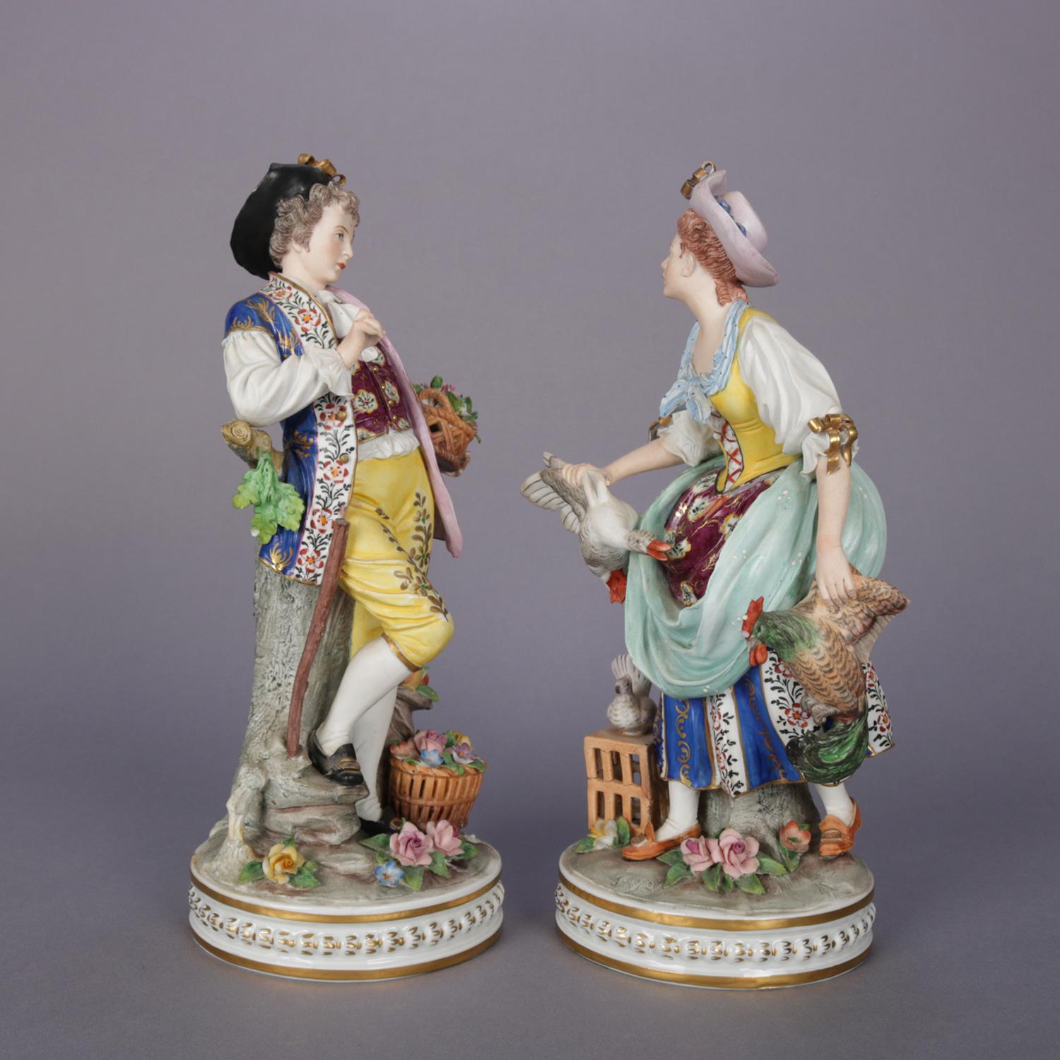 Antique and large pair of Chelsea School hand painted porcelain figures feature courting couple in countryside setting with man having birds, fruit and flowers and woman having pheasant, gilt highlights throughout, circa 1890

Measures - Female