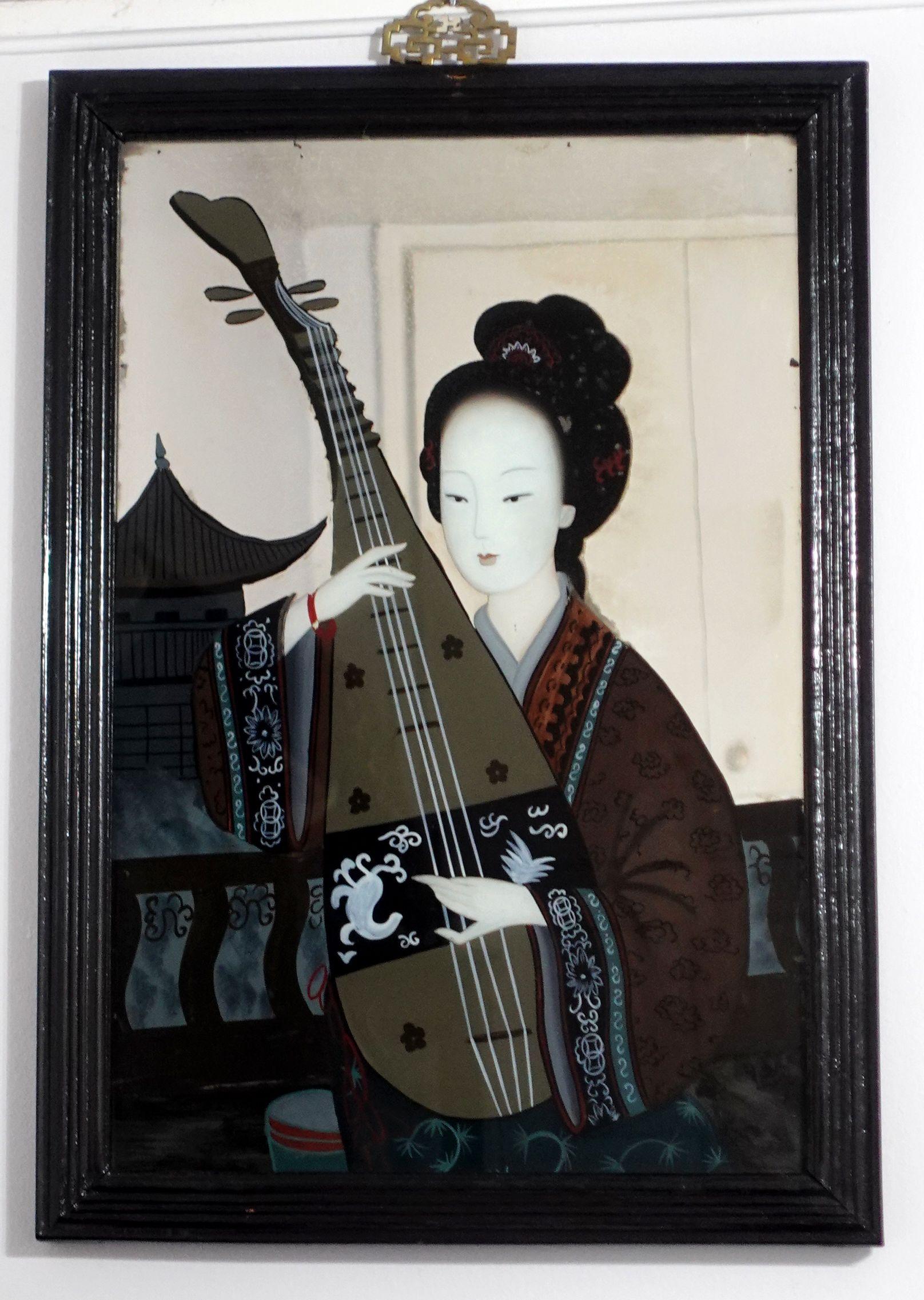 A large charming late 19th-century to early 20th-century, Chinese export reverse mirror painting, depicting a lady playing a Chinese musical instrument in her library. The painting comes with its original hardwood frame and the old pins in the back