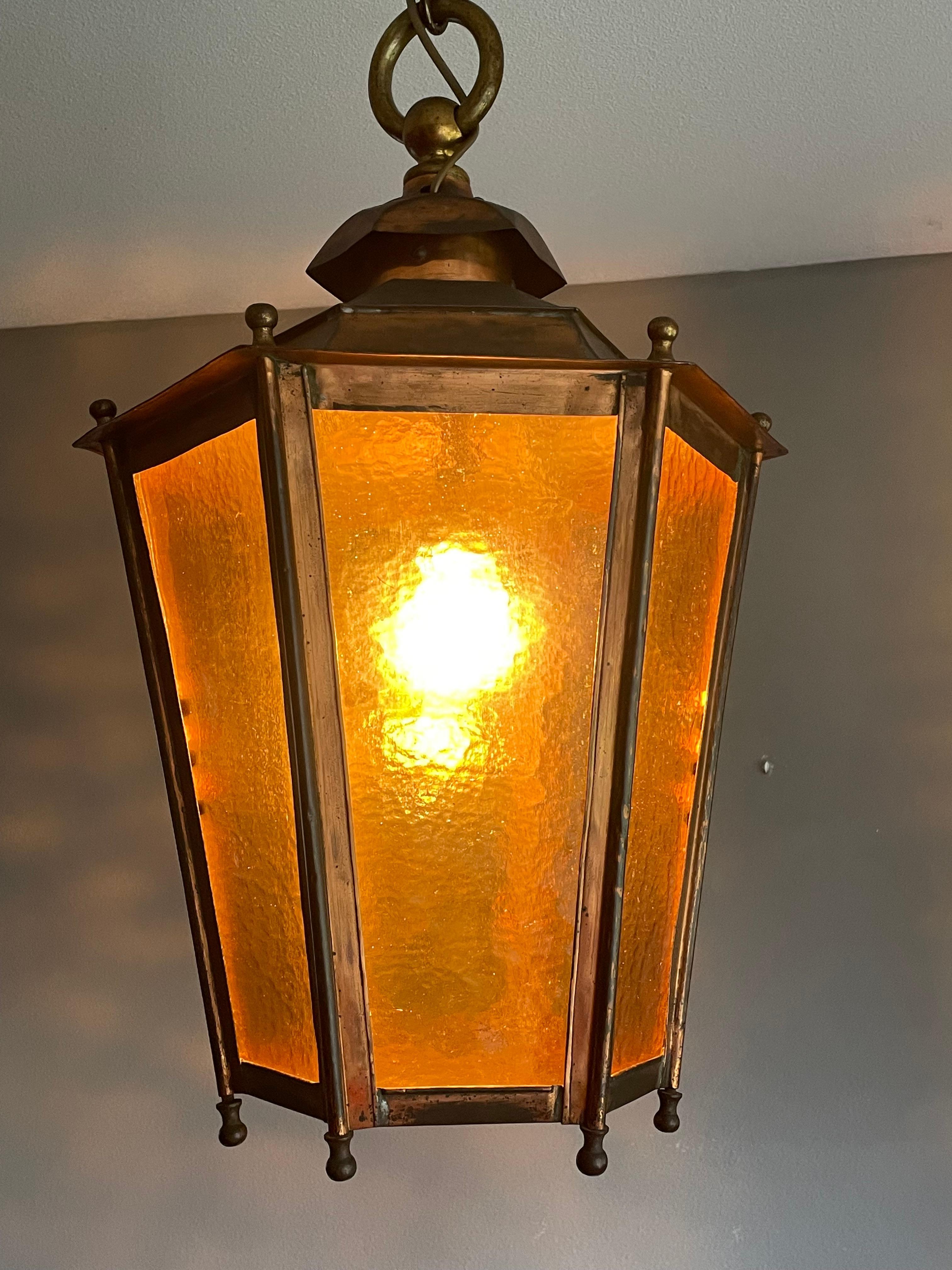 One of a kind, great looking and all handcrafted antique copper pendant with cathedral glass.

With antique light fixtures as one of our specialties, we know how rare large copper lanterns from the late 1800s are and to have found one of this age,
