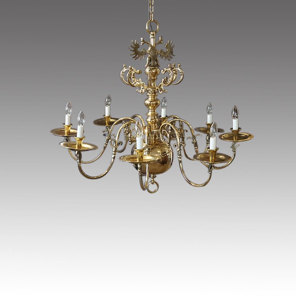 Large antique cast bronze chandelier 
This magnificent Large antique cast bronze chandelier was made circa 1910.
Having the double eagle at the top with a turned brass column down to the large sphere that was to reflect extra light into the areas