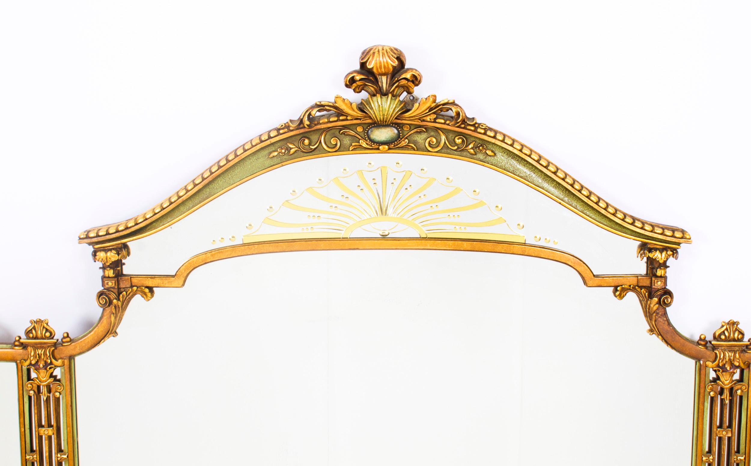 This is a beautiful large antique English Art Deco overmantle mirror, Circa 1920 in date.

The elaborately shaped mirror features a finely carved gilded frame hand painted with flowers. It is surmounted with a beautifully carved acanthus crest and