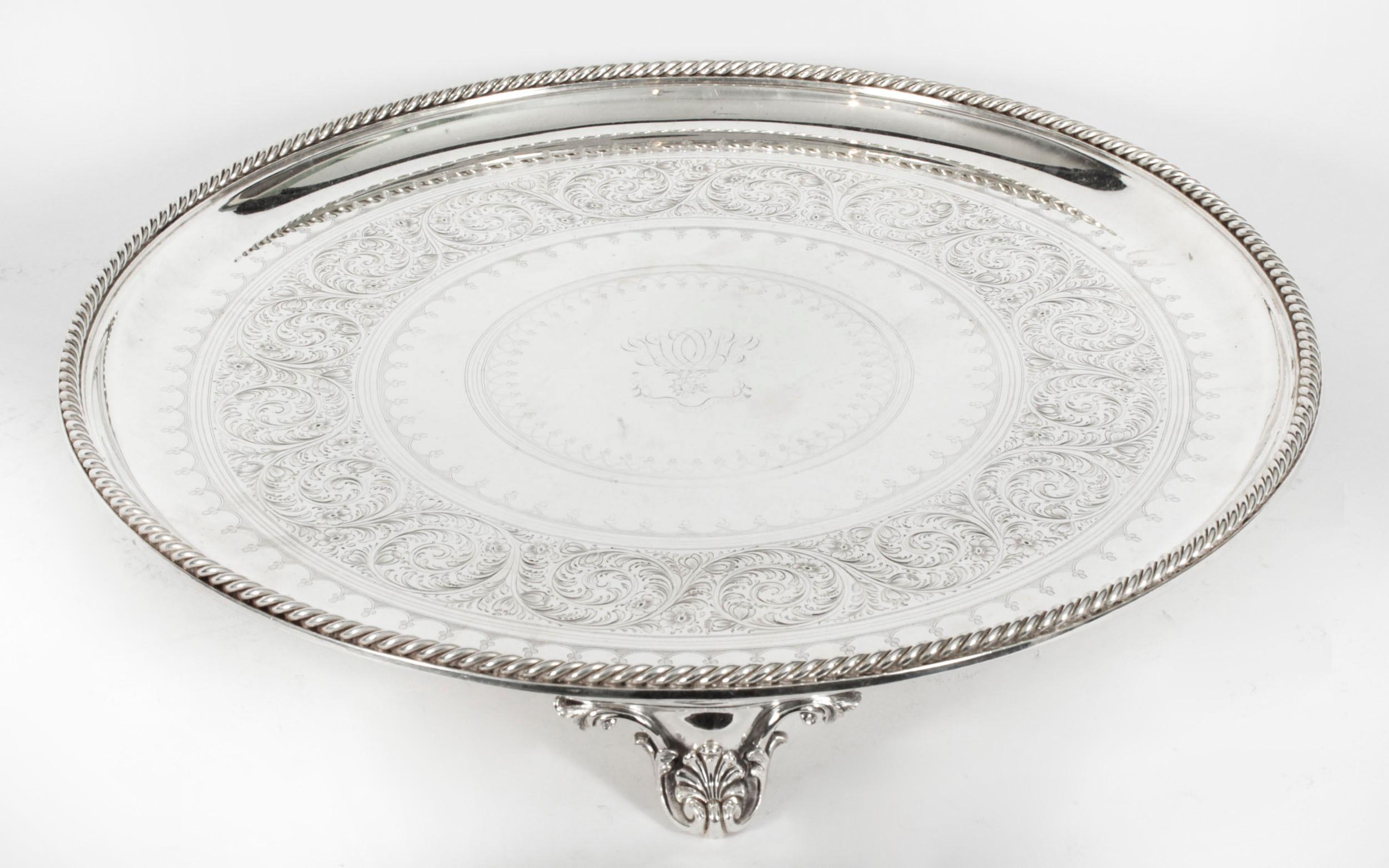 This is a large wonderful antique silver plated Victorian salver bearing the makers marks for the renowned silversmith Elkingon and the date mark for 1888.
 
It has beautiful embossed and engraved floral and foliate decoration in the Neo-classical