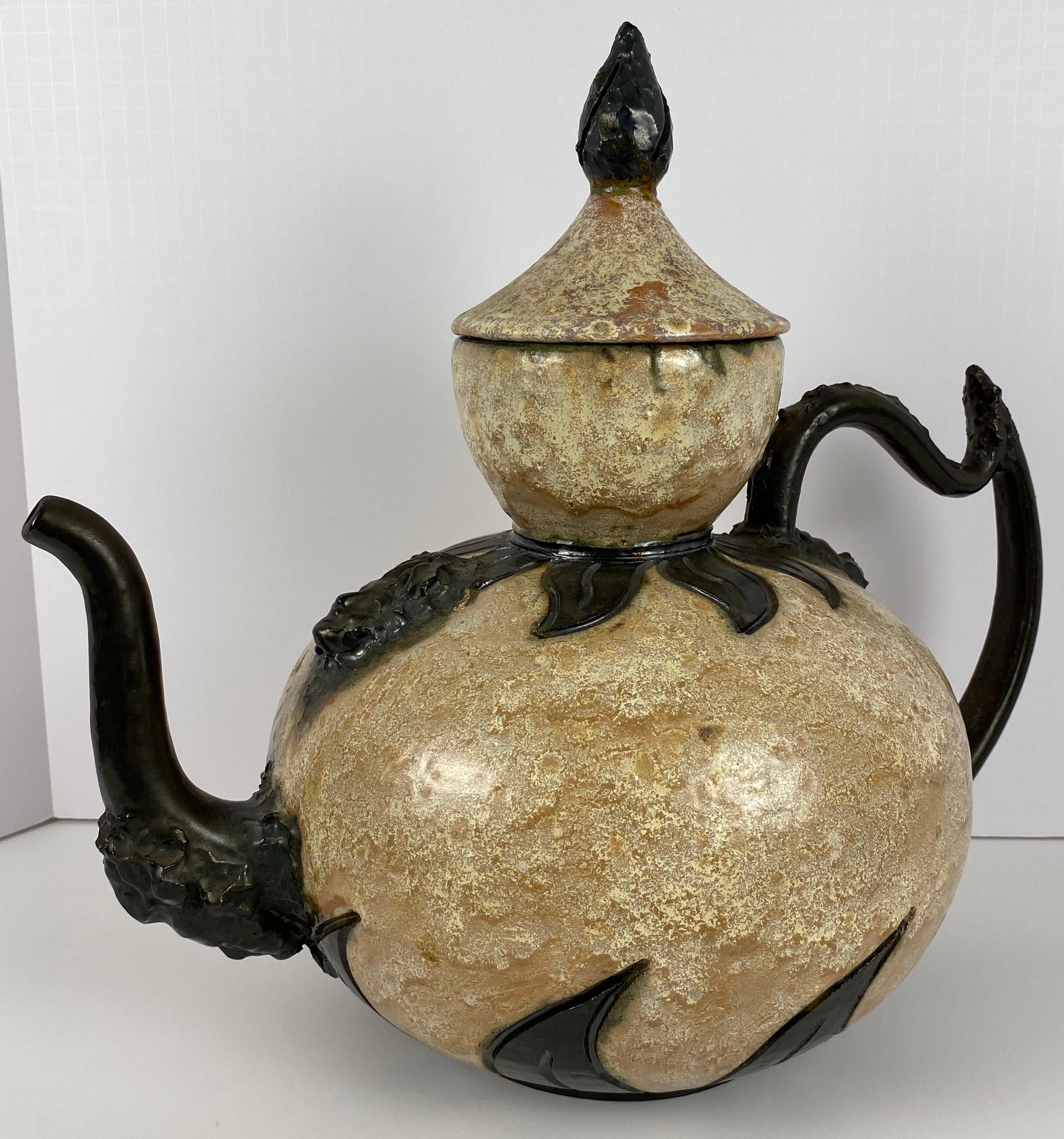 Stunning Art Deco style stoneware vase attributed to S. Hublet (Sylvain Hublet). Hand-crafted, this vessel has a granite like beige, pink and black surface accented by freeform chevrons on the top and the bottom. The center of this magnificent