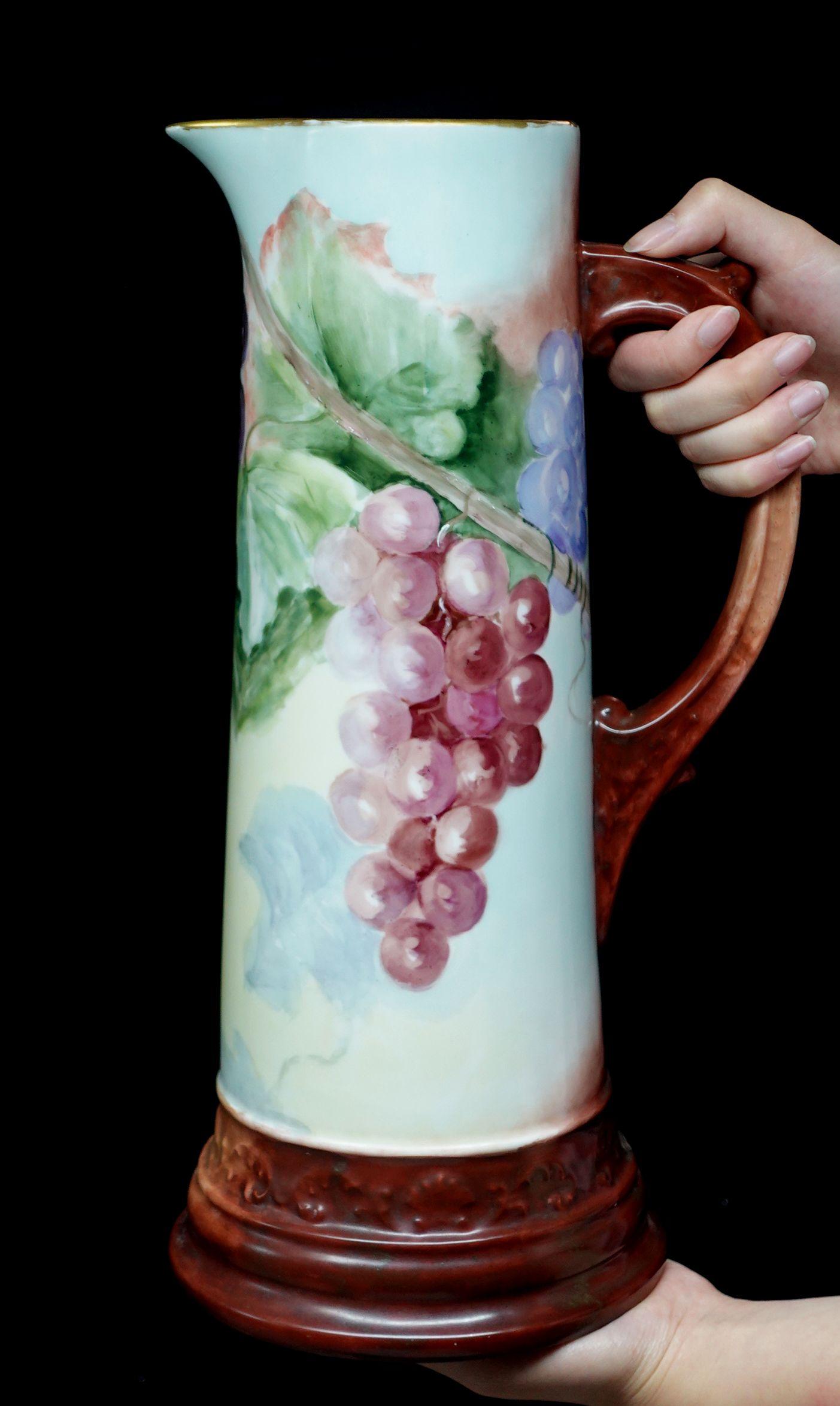 A wonderful antique large antique French Jean Pouyat Limoges figural porcelain decorated tankard offers a scalloped rim absolutely 100% hand-painted grapes in brown-red, purple, and rich green leaves, delicate arrangement of the composition, light