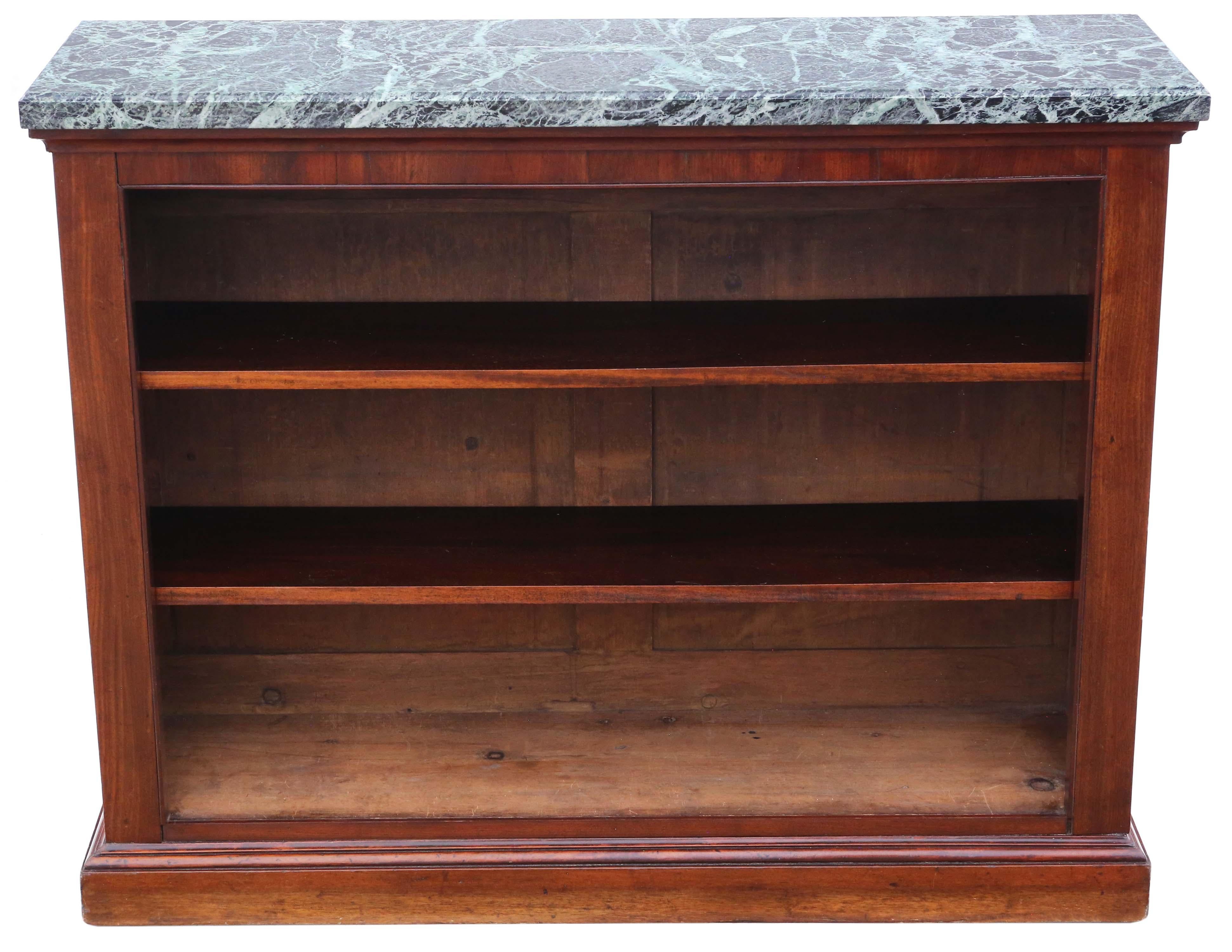 Antique large fine quality 19th Century mahogany and marble bookcase.

This is a lovely quality bookcase, that is full of age, charm and character.

Solid, with no loose joints and no woodworm.

The shelves are held in place by fixed supports. We