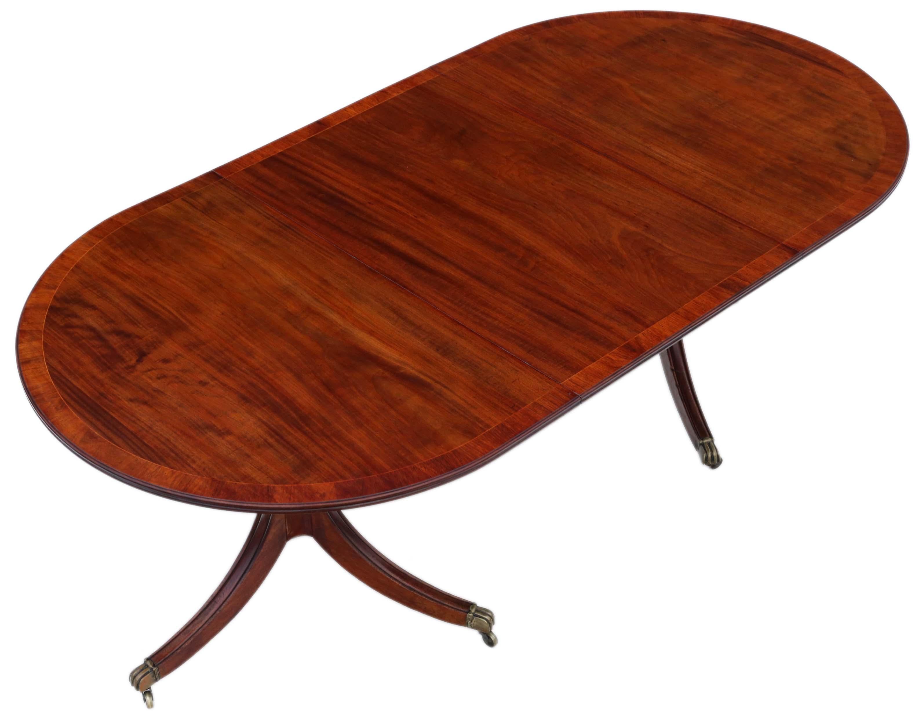 Antique large fine quality ~7' mahogany extending dining table double pedestal 19th century.

The table has a lovely colour, cross-banding and stands on quality period brass castors.

An attractive table that is solid, strong and has no loose