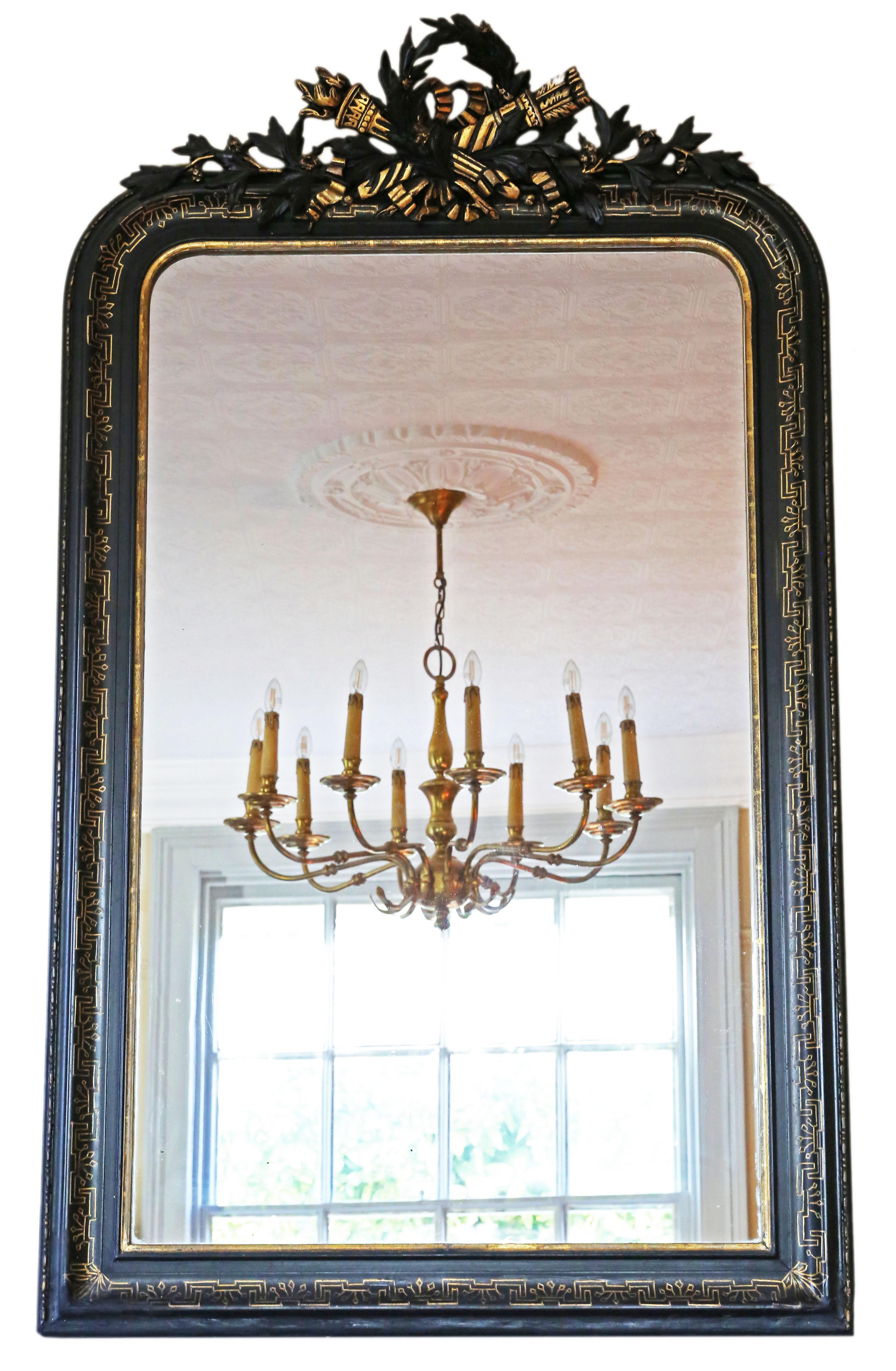 Antique large fine quality decorative ebonised and gilt overmantle wall mirror, 19th Century.

An impressive rare find, that would look amazing in the right location. No loose joints or woodworm.

The mirrored glass has light oxidation/hazing