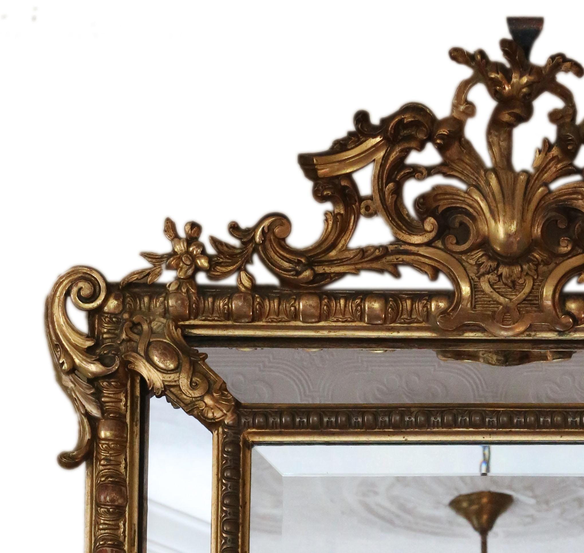 Antique large fine quality decorative gilt cushion overmantle wall mirror, 19th Century.

An impressive rare find, that would look amazing in the right location. No loose joints or woodworm.

The main bevel edge mirrored glass has light