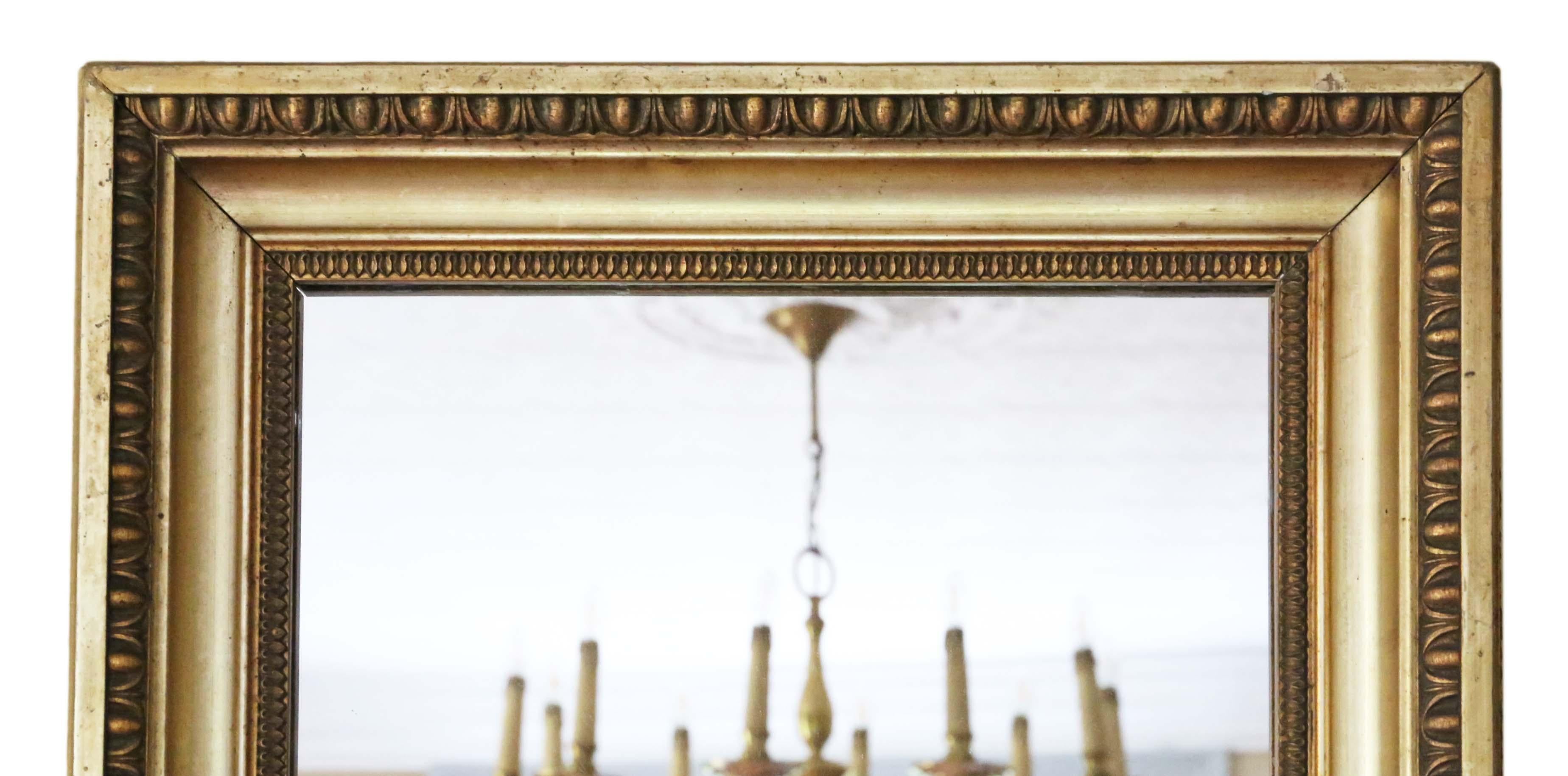 Antique large fine quality gilt wall overmantle mirror 19th Century.

An impressive and very rare find, that would look amazing in the right location. No loose joints or woodworm.

Frame has its original finish with minor decorative losses,
