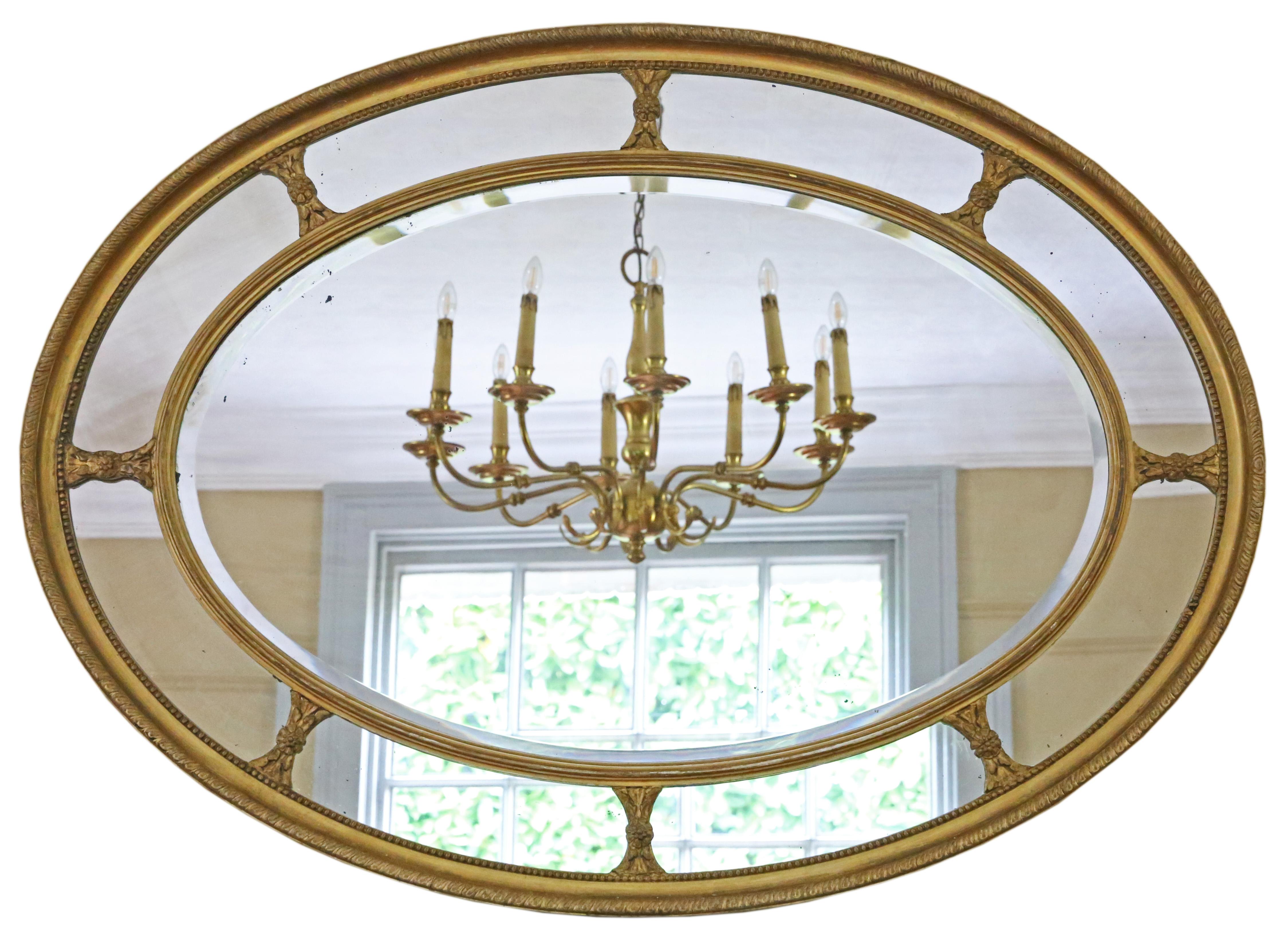 Antique large fine quality oval gilt overmantle cushion wall mirror 19th Century.

An impressive rare find, that would look amazing in the right location. No loose joints or woodworm.

The main bevel edge mirrored glass and outer segments have light