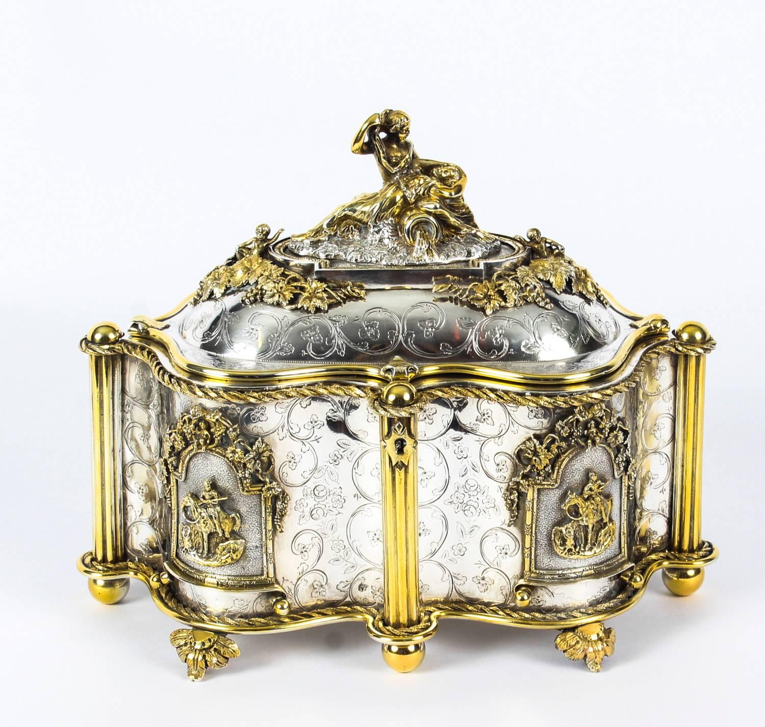 A beautiful French gilt and silver plated bronze jewellery casket, circa 1870 in date.
 
The shaped-oval casket features superb engraved decoration and beautifully reeded pillar supports with cast and applied equestrian panels to the engraved