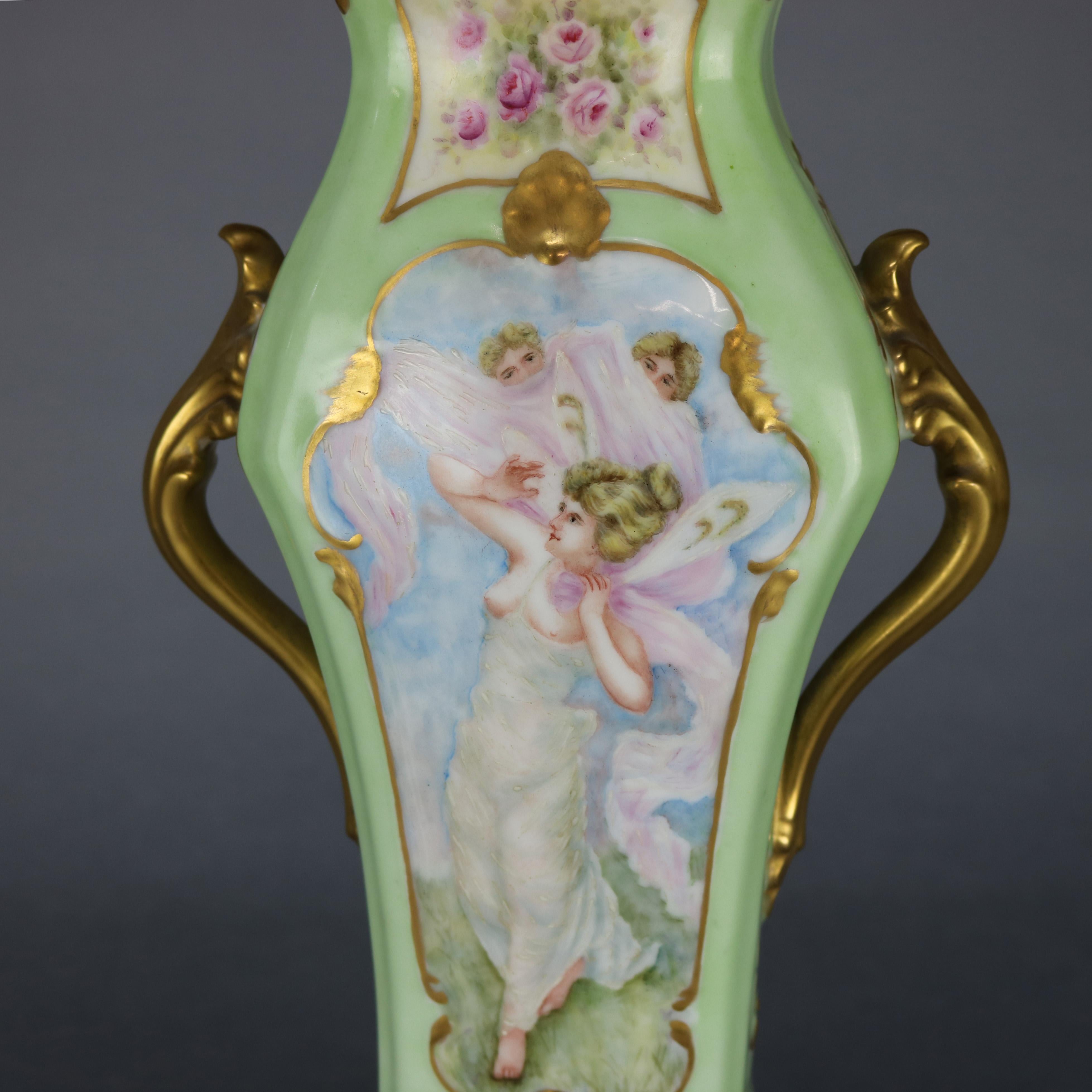 An antique and large French Limoges vase offers porcelain construction with hand painted reserve with classical scene including lady with cherubs, flanking acanthus form double handles, and raised on scroll foot base, heavy gilt highlights
