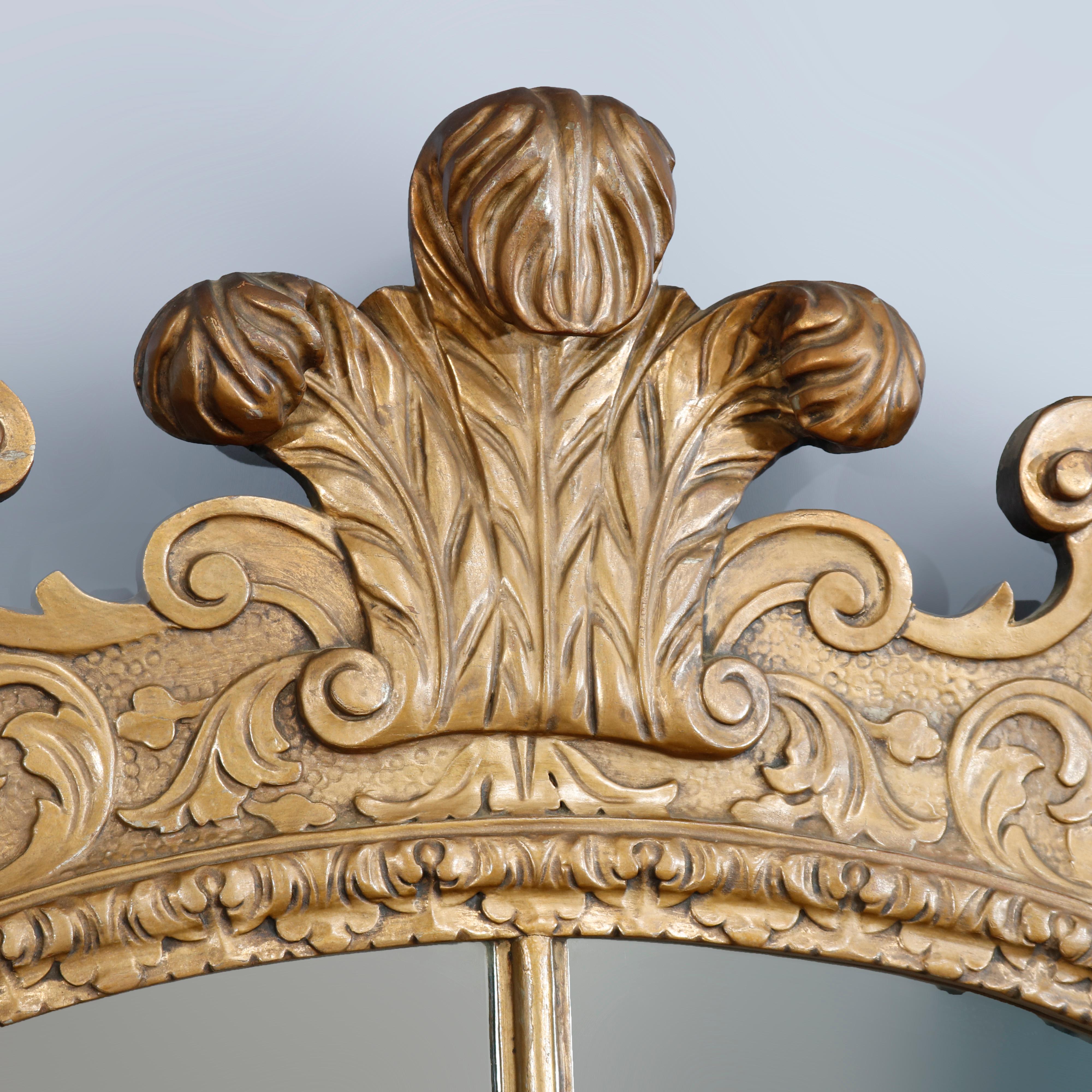 An antique and large French Louis XV parclose wall mirror offers shaped giltwood frame with palmette crest surmounting frame with scroll and foliate embossed design and shell at base, c1910

Measures- 55.38