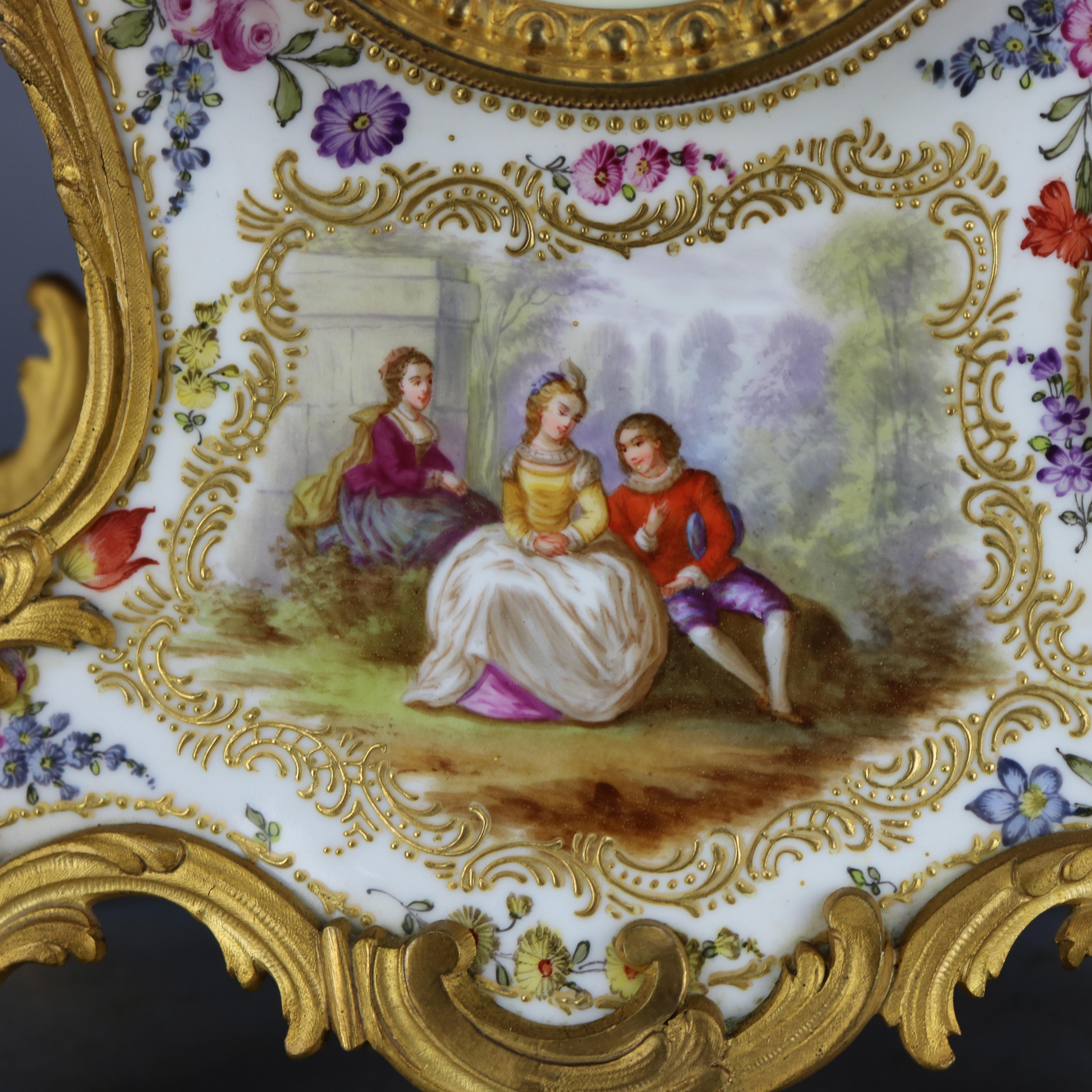 An antique and large French Louis XVI (elements of Rococo) mantel clock offers hand painted porcelain case with overall detached floral spray and reserve depicts courting couple in countryside setting, gilt cast bronze scroll and foliate mounts