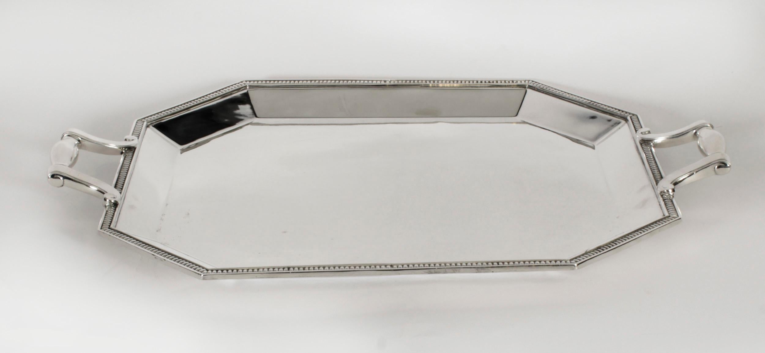 This is a high quality large antique French silver plated butlers tray bearing the makers mark of the highly sought after French silversmith and retailer Christofle, circa 1930 in date.
 
This rectangular shaped stunning tray with gut off corners