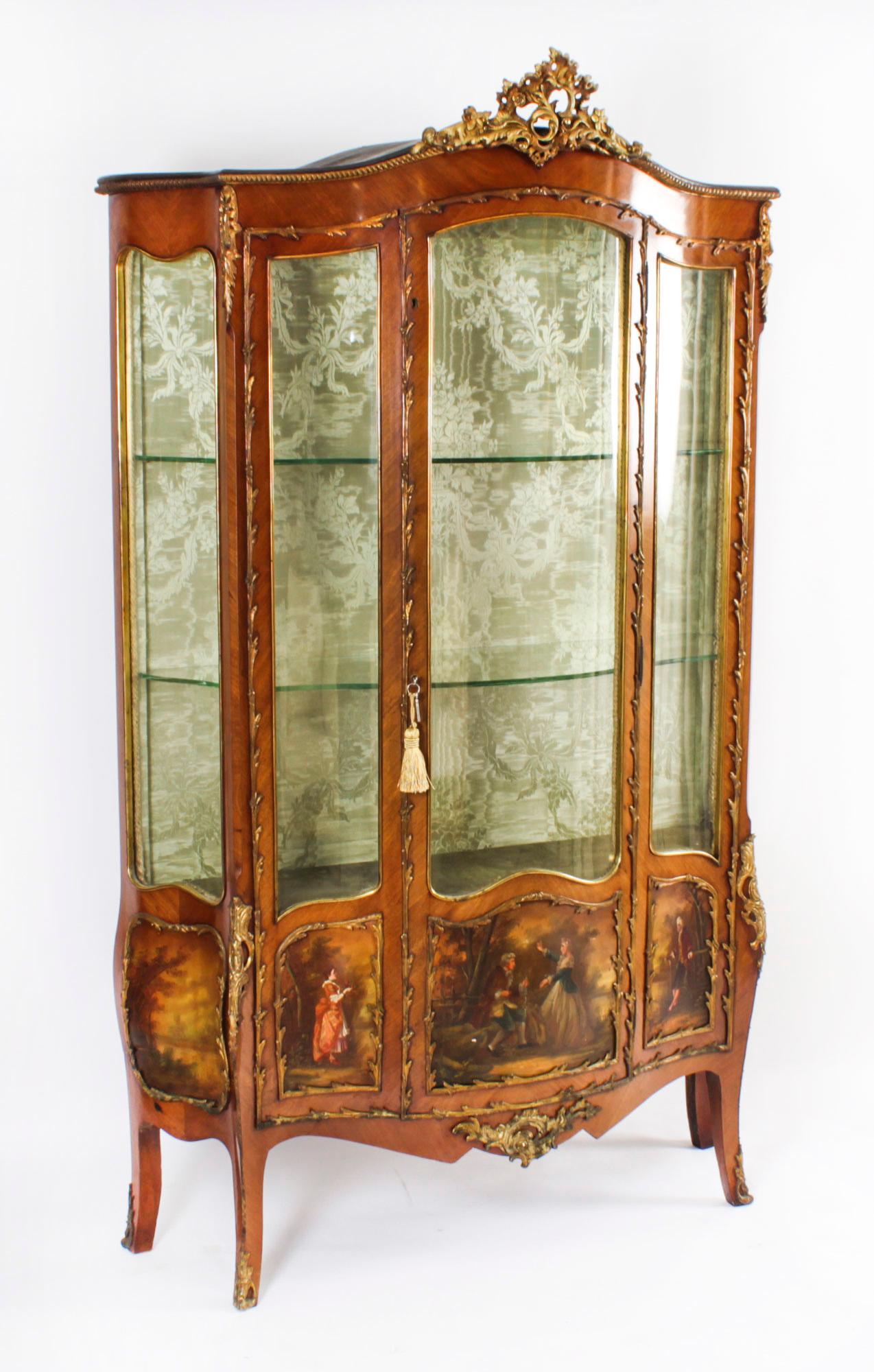 A stunning antique Louis XV Revival French Vernis Marten five panel display cabinet of extravagantly shaped serpentine form, Circa 1880 in date, with exquisite hand painted decoration and exquisite ormolu mounts.

There are five Vernis Martin panels