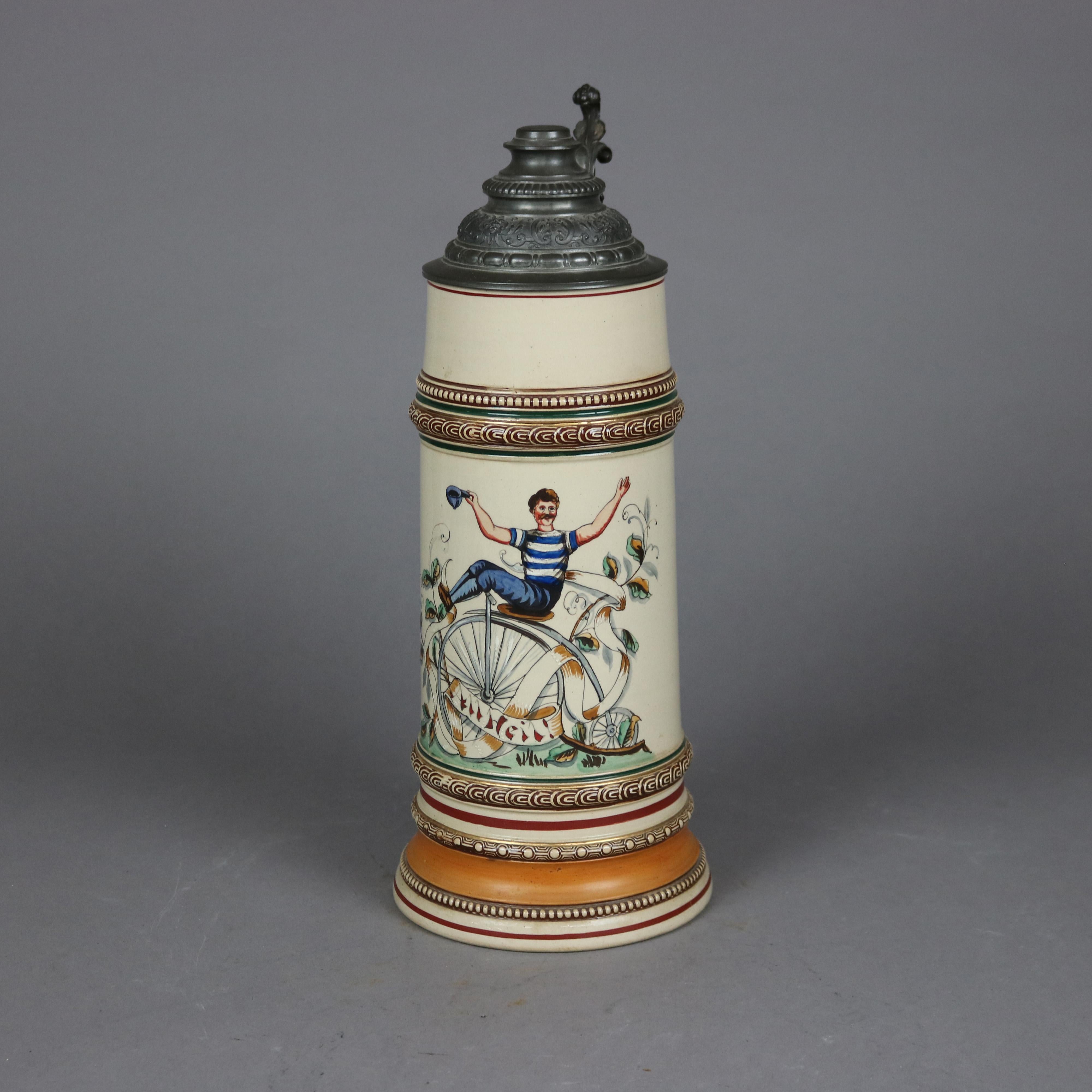An antique and large German beer stein offers stoneware construction with bicycle scene and hinged pewter lid having foliate form handle, c1900

Measures - 15.5'' H x 5.75'' W x 8'' D.