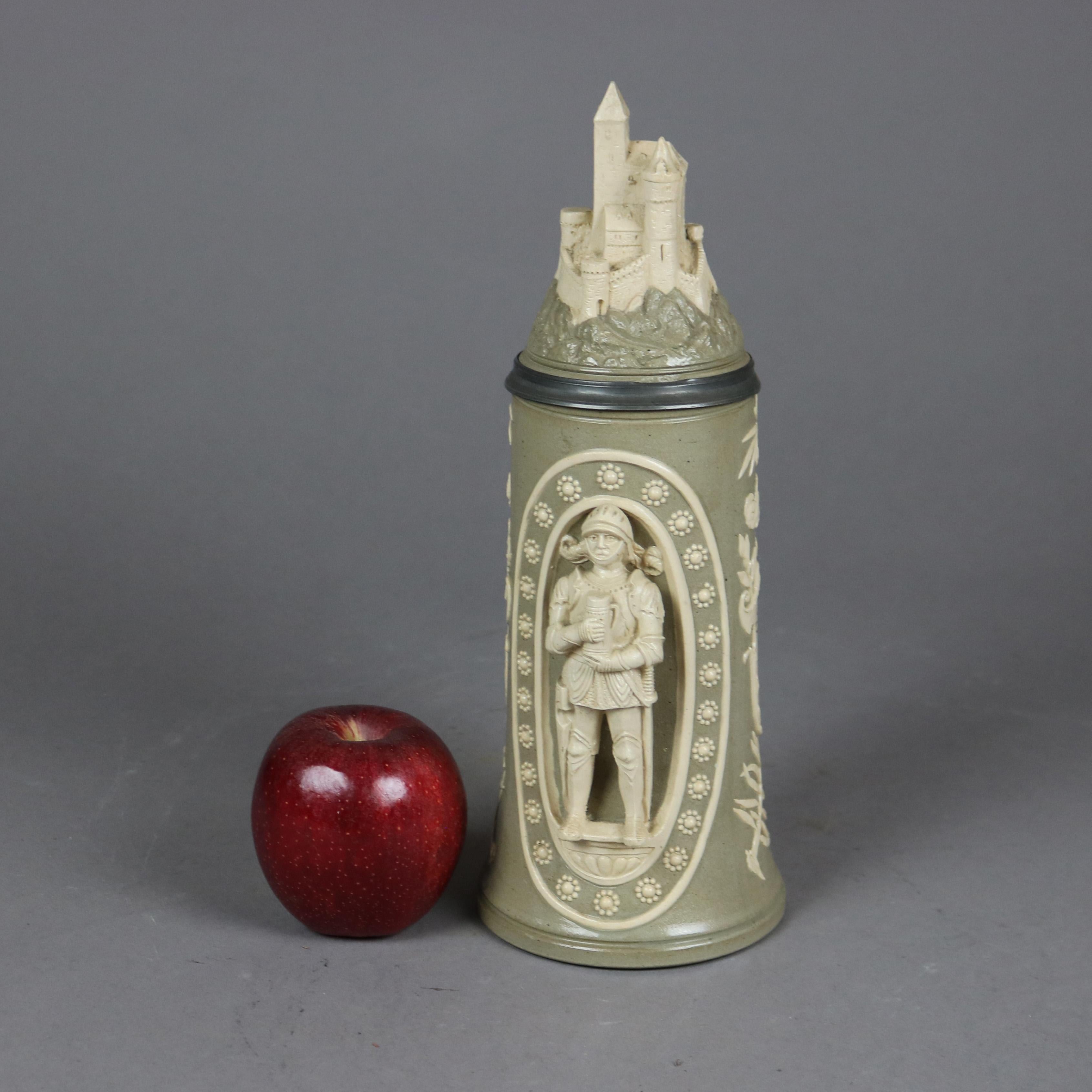 An antique and large German beer stein offers stoneware construction with reserves having knight figure, hinged pewter lid with castle finial and stamped as photographed, c1900

Measures- 11.25'' H x 4'' W x 5.75'' D.

Catalogue Note: Ask about