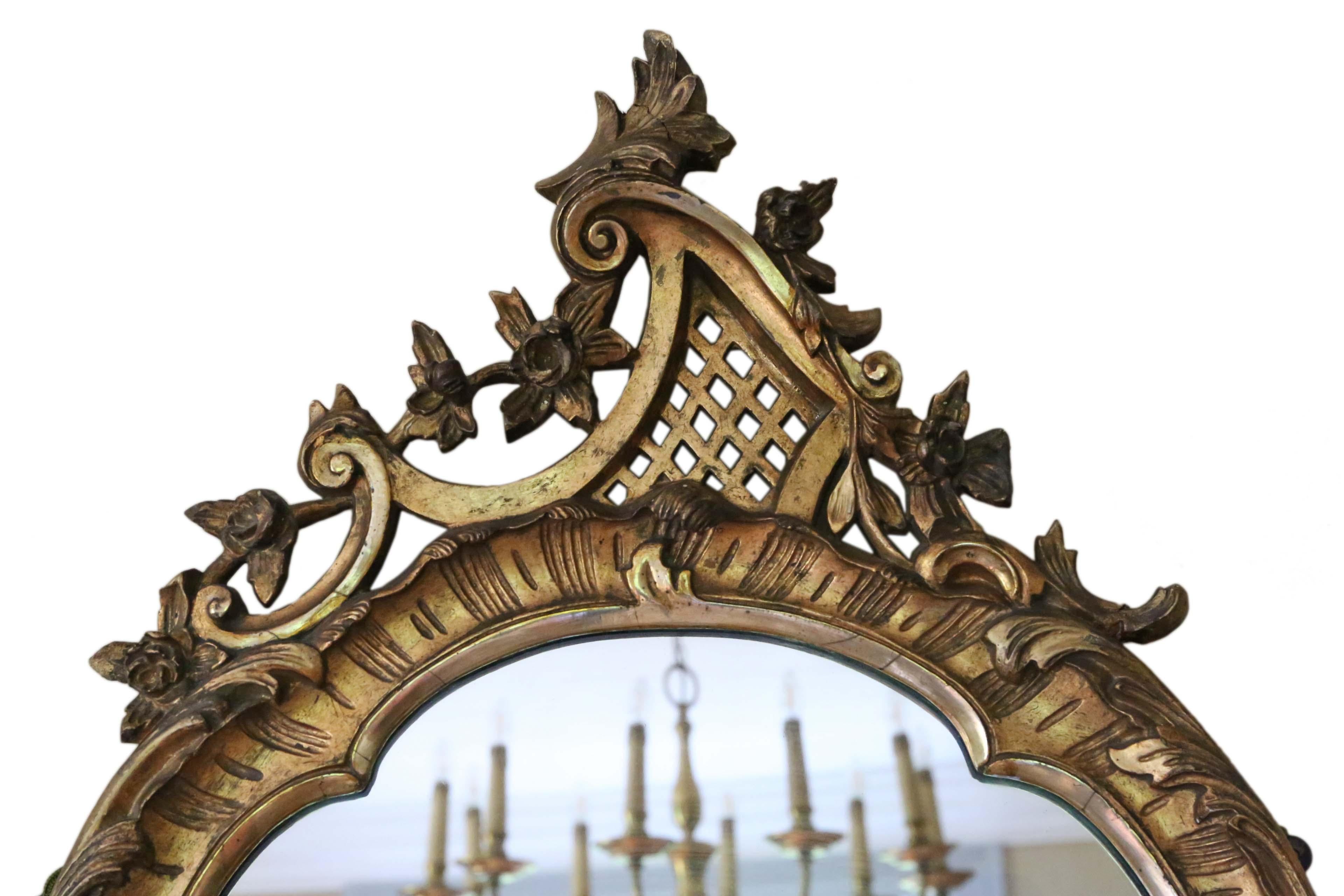 Antique large fine quality gilt 19th century overmantle or wall mirror. Lovely charm and elegance.

An impressive and rare find, that would look amazing in the right location. No woodworm.

The original mirrored glass is in good condition with