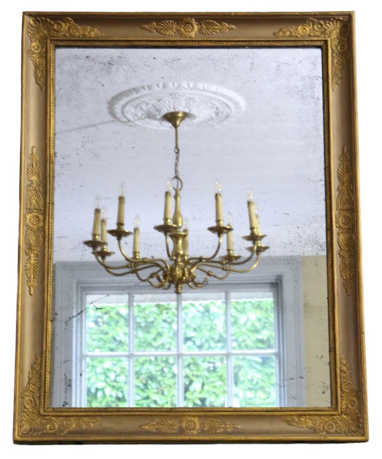Antique large gilt overmantle wall mirror from the 19th Century, exuding quality craftsmanship.

This mirror enchants with its simple yet elegant design, bringing character to any suitable space. The frame is sturdy, with no loose joints.

The