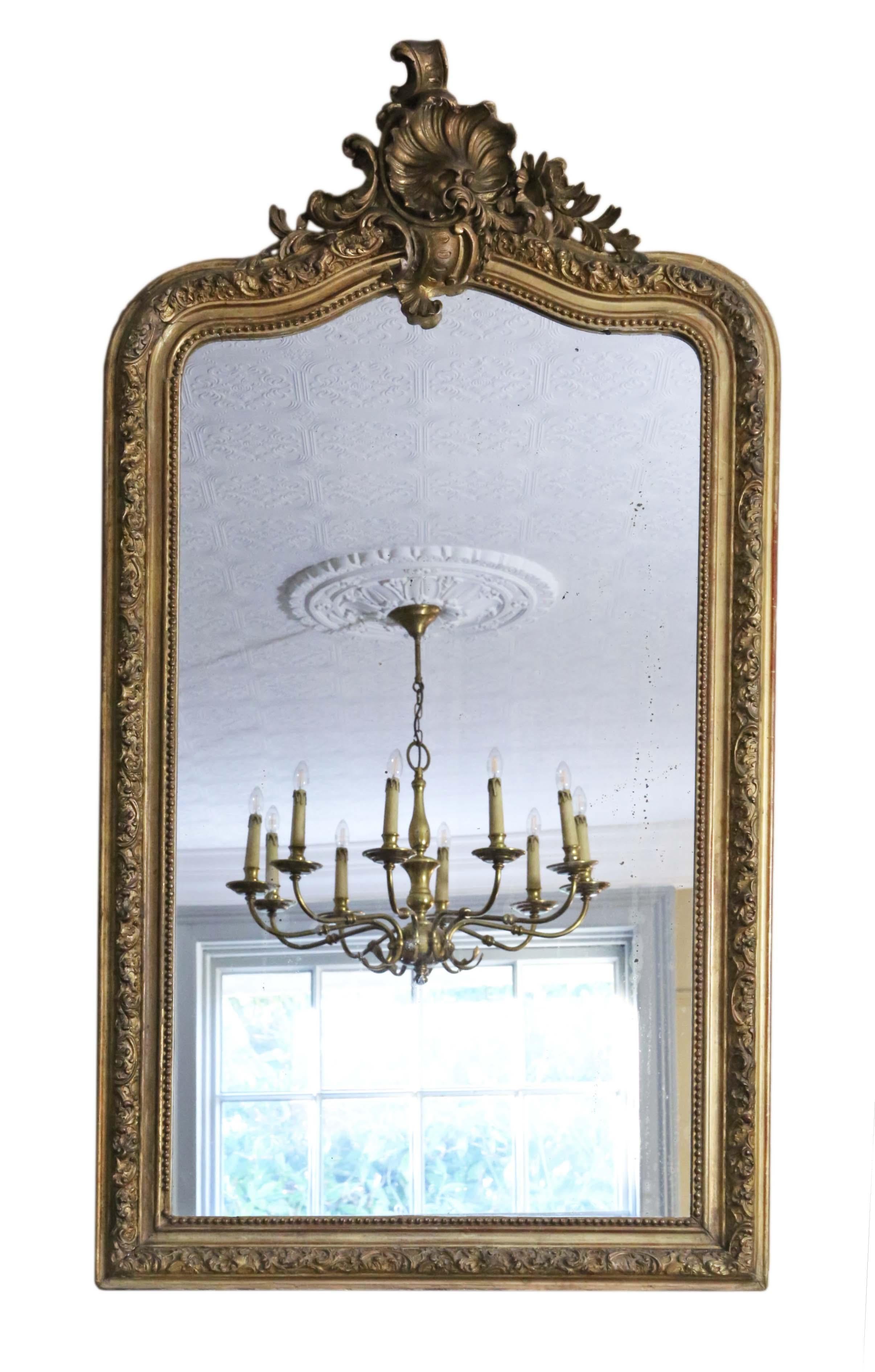 Antique large fine quality gilt wall mirror or overmantle 19th Century.

An impressive rare find, that would look amazing in the right location. No loose joints or woodworm.

The original mirrored glass has light/medium oxidation and age related