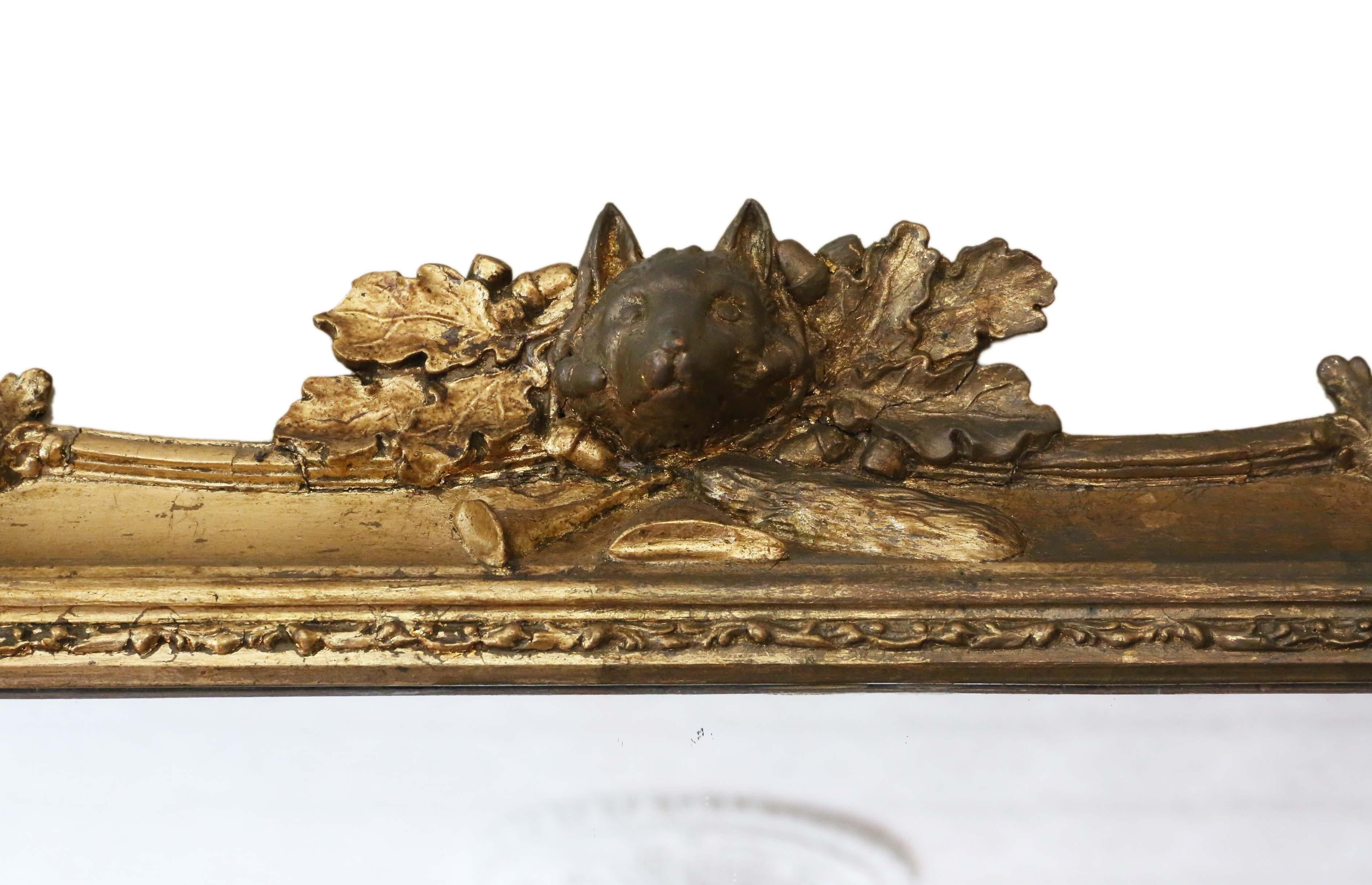Antique large fine quality gilt wall mirror or overmantle 19th Century, with a Fox hunting theme. Lovely charm and elegance.

An impressive rare find, that would look amazing in the right location. No loose joints or woodworm.

The mirrored