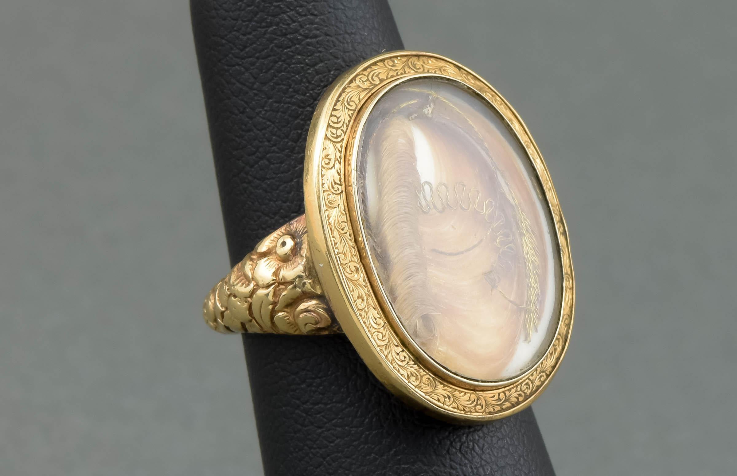 Dating to 1860, this lovely Victorian hair work ring was likely once a sentimental or mourning brooch or pendant. At some point in the Victorian period it was converted into the lovely ring it is now.

Crafted of gold testing between 10K and 14K,
