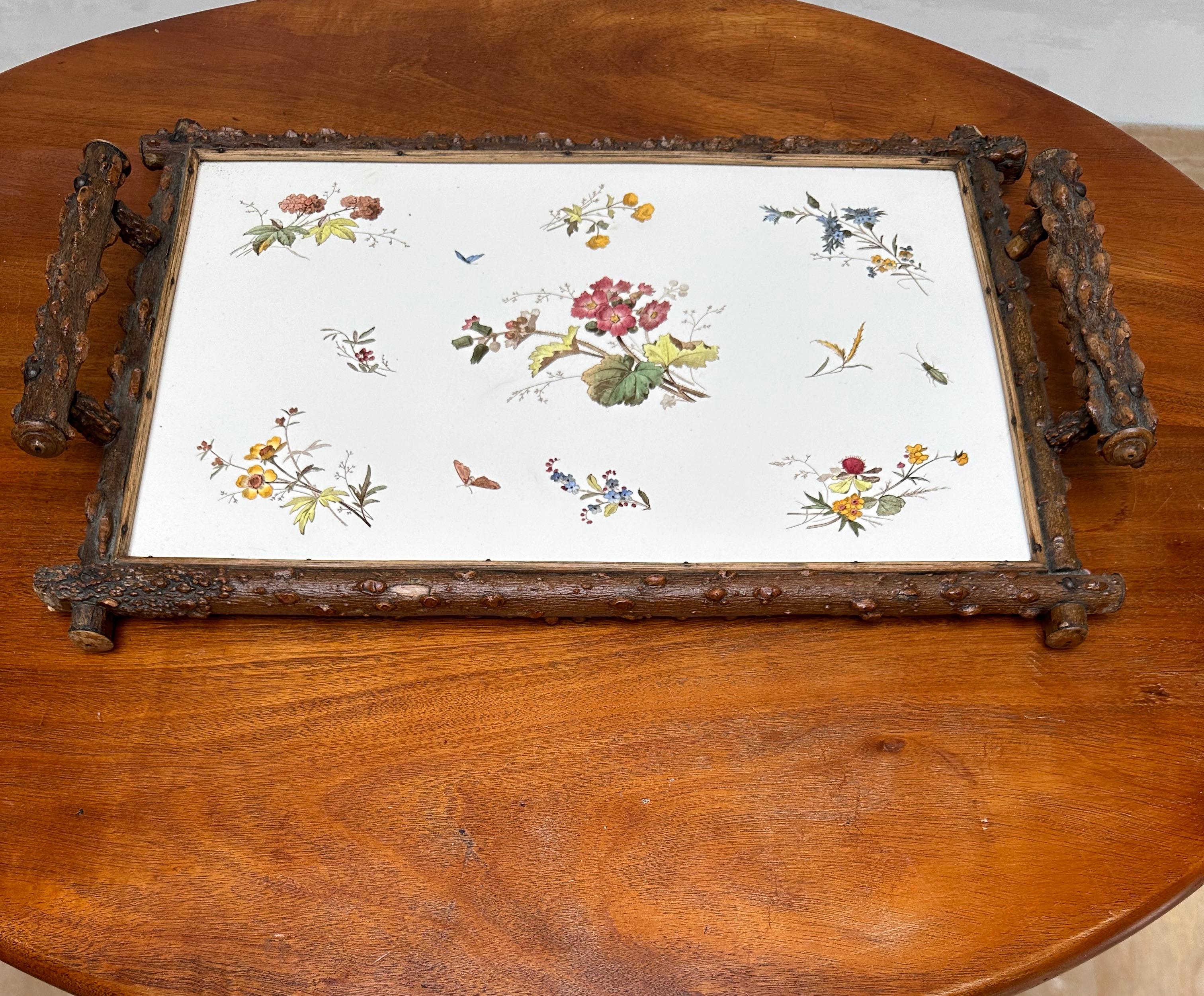 Rare and beautifully hand painted and glazed, porcelain tile in superb condition with branches frame serving tray.

This beautiful quality and marvelous design tile serving tray is another one of our recent decorative finds and an absolute joy to