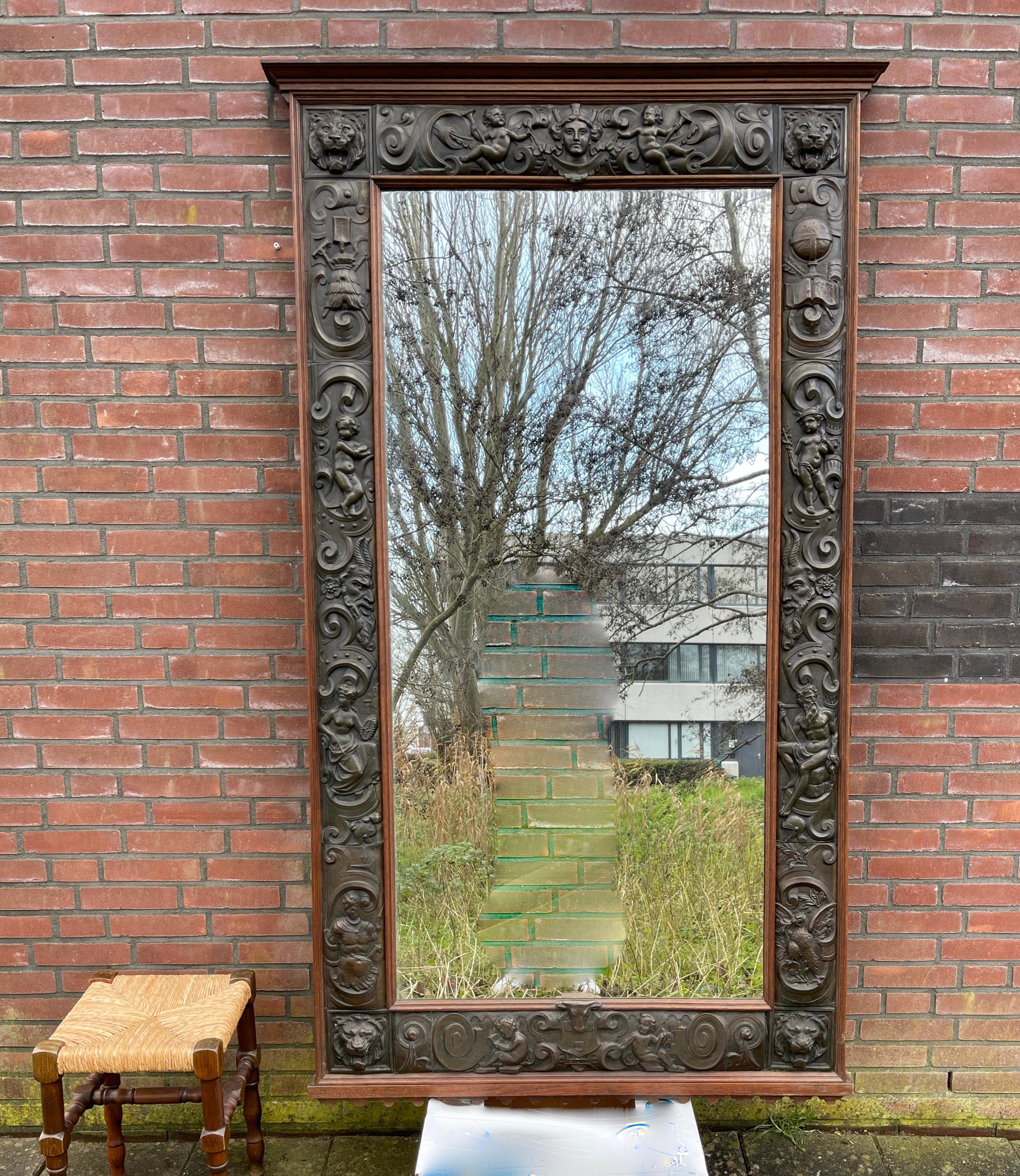 Exceptional, unique and meaningful antique wall mirror.

It does not matter how long you have been collecting or selling antiques, we are certain you will have never seen a mirror like this. The extra large size is one thing, but what makes it