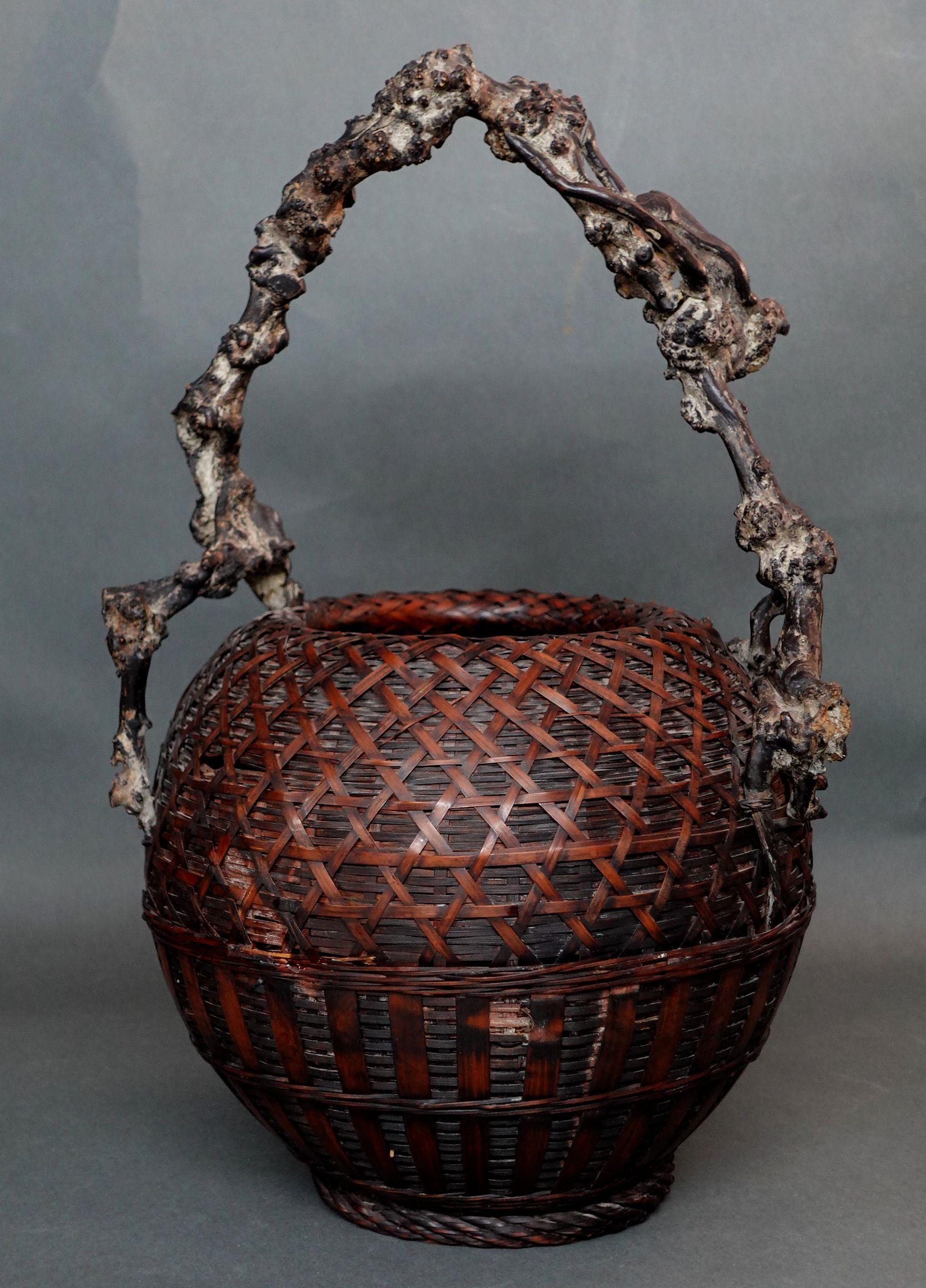 An absolutely beautiful antique of a Large Japanese Bamboo and Root Handle Ikebana Basket
     